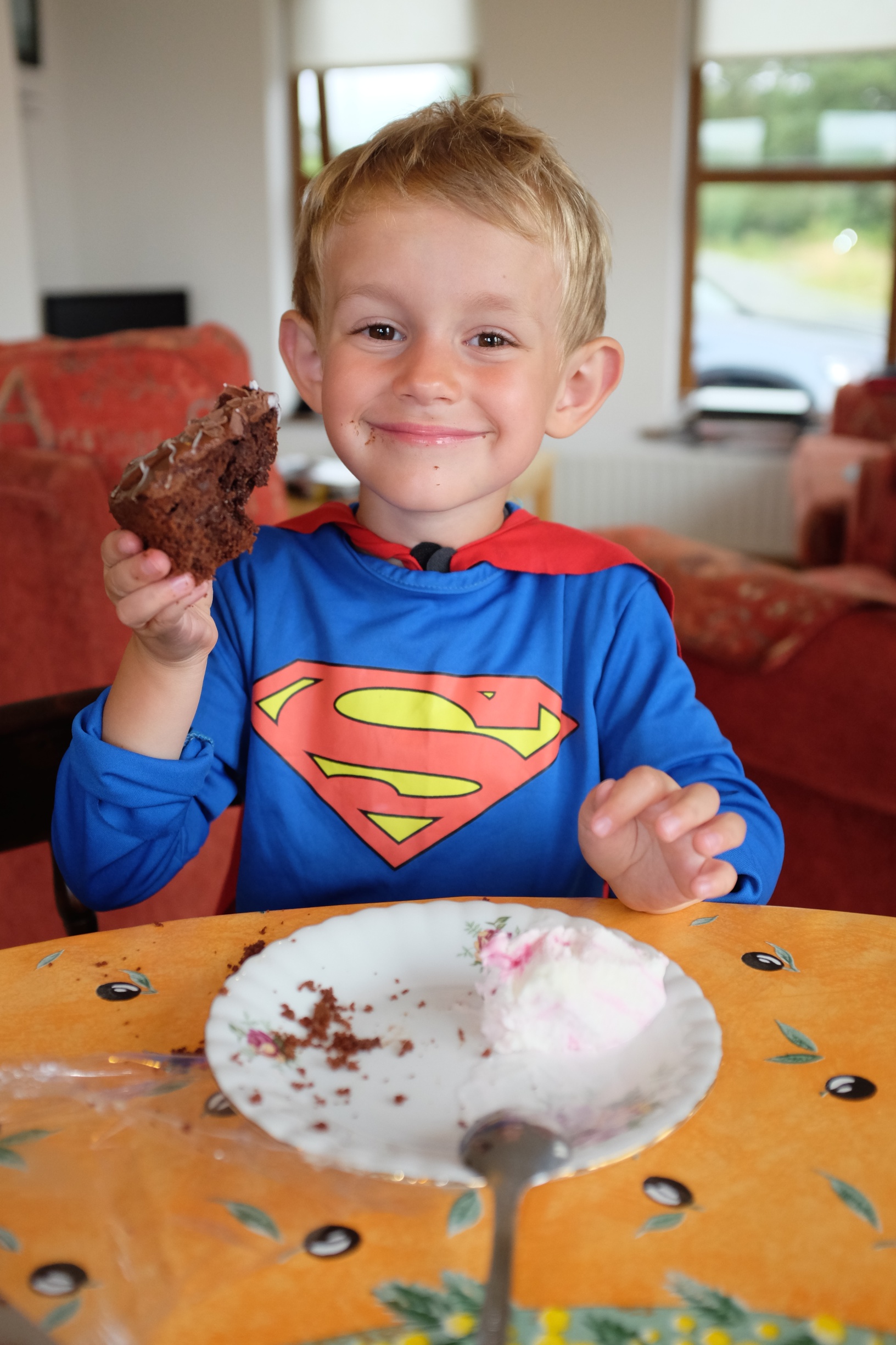 Kian loving his slice of chocolate cake