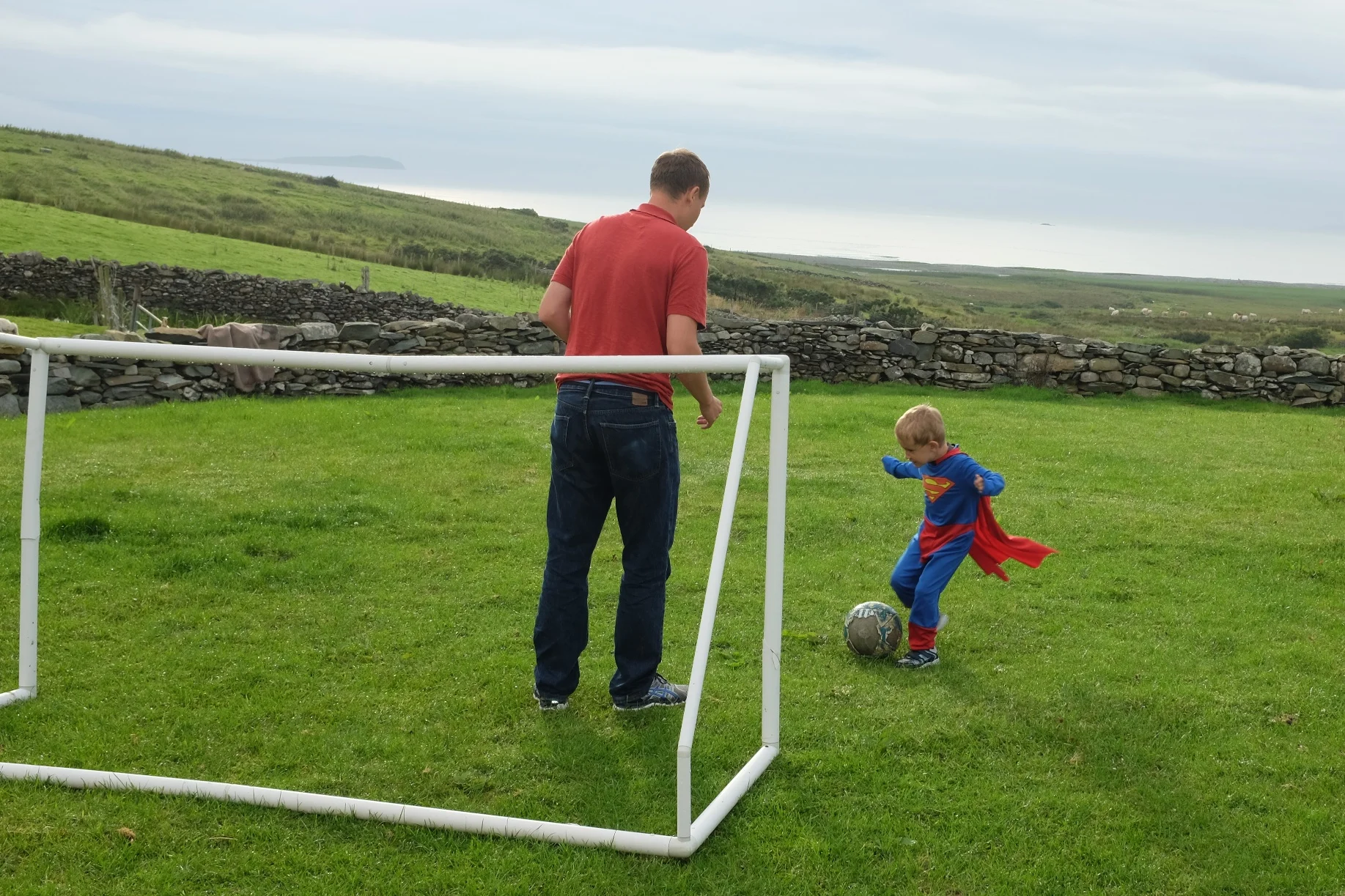 Superman getting ready to kick the ball.. it's never a fair match when you're up against Superman!