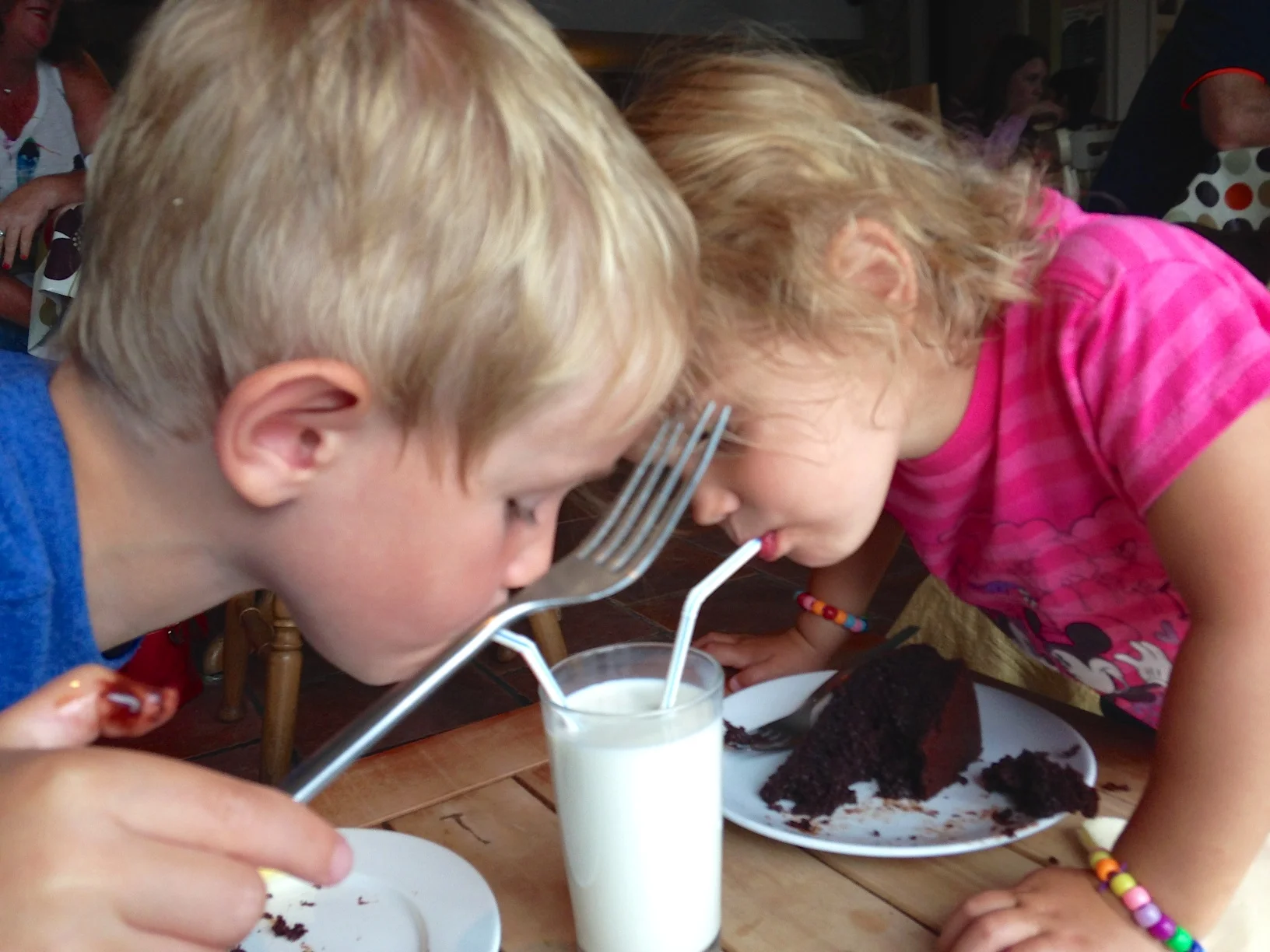 Little swimmers loving their delicious chocolate cake and milk