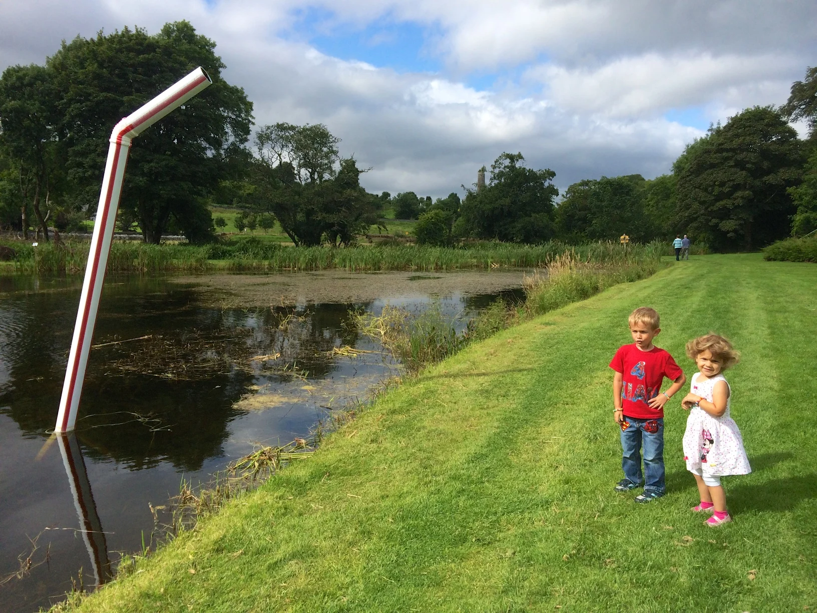 Kian trying to slurp up the lake with the straw - "The installation of the straw sculpture is intended to highlight the current issue of water charges and water equality in Ireland. The placement of the straw in the lake should remind people where their water comes from and how much of it is left". -Paul O'Driscoll (Artist and Musician in Mayo)