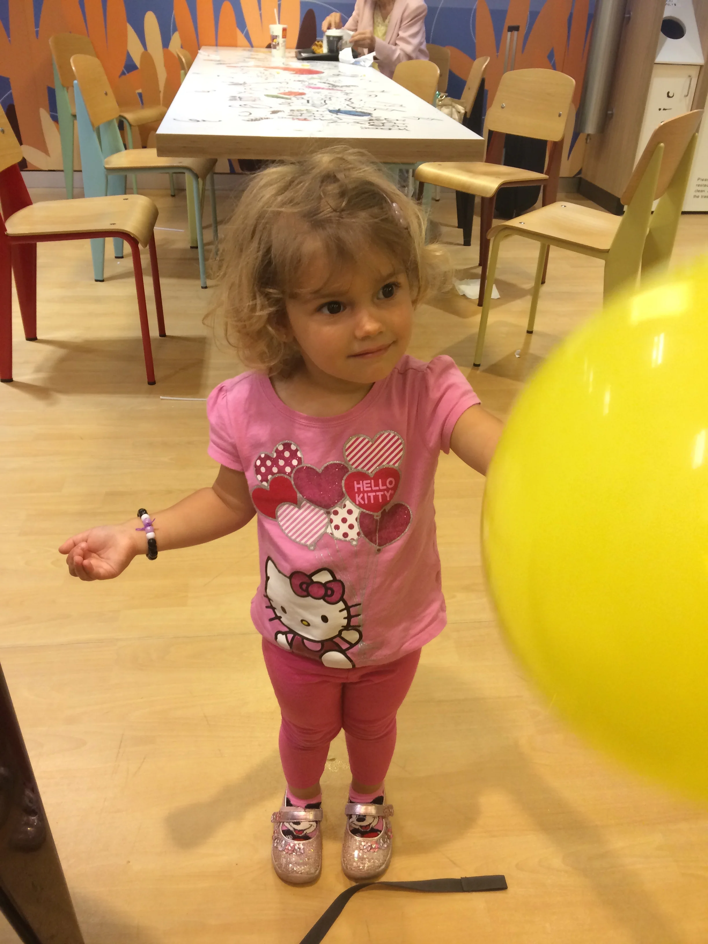 Hannah and her yellow balloon that she left for "other kids" after we left the play area