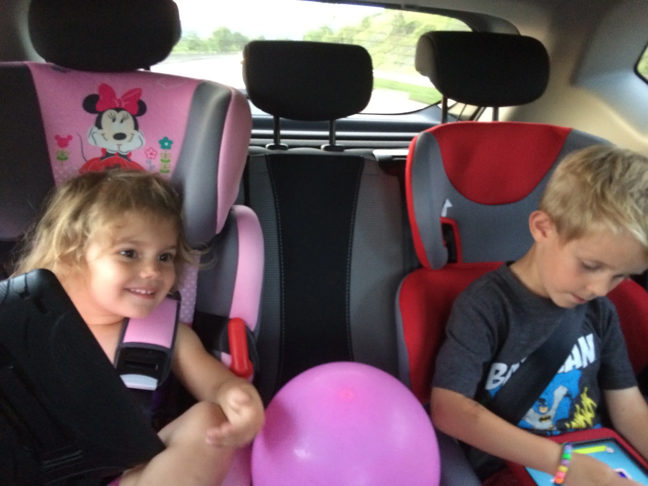 Kids strapped into their new car seats