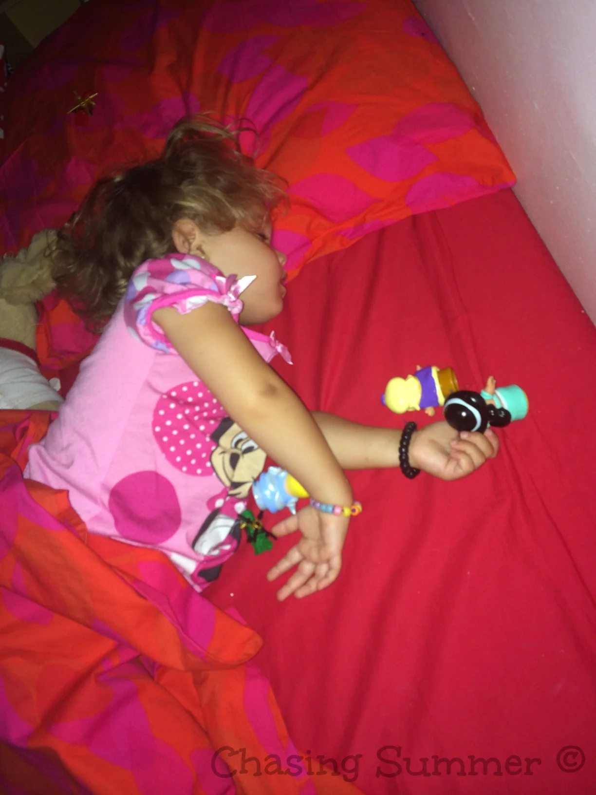 Hannah sleeping with Jasmine and Aladdin nearby :) 
