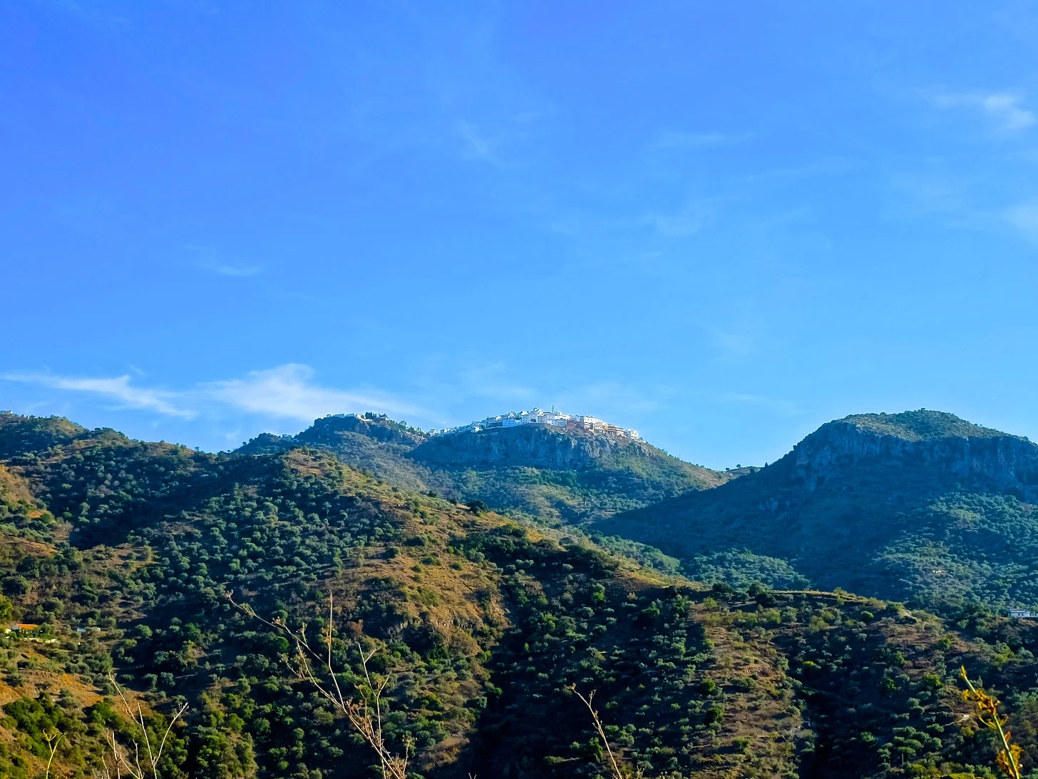 If you look closely at the top of that middle mountain, you can see the village of Comares