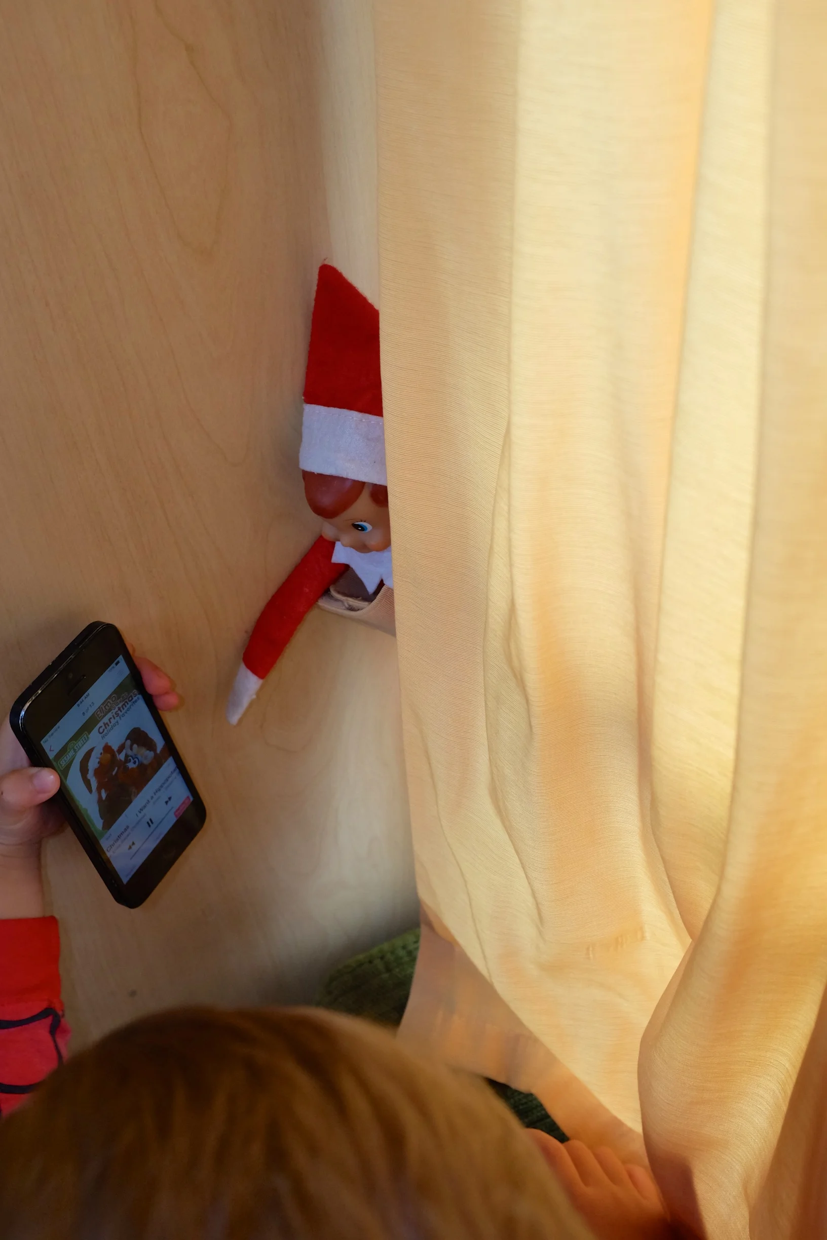 Kian sharing the Elmo Saves Christmas songs with Elmer.