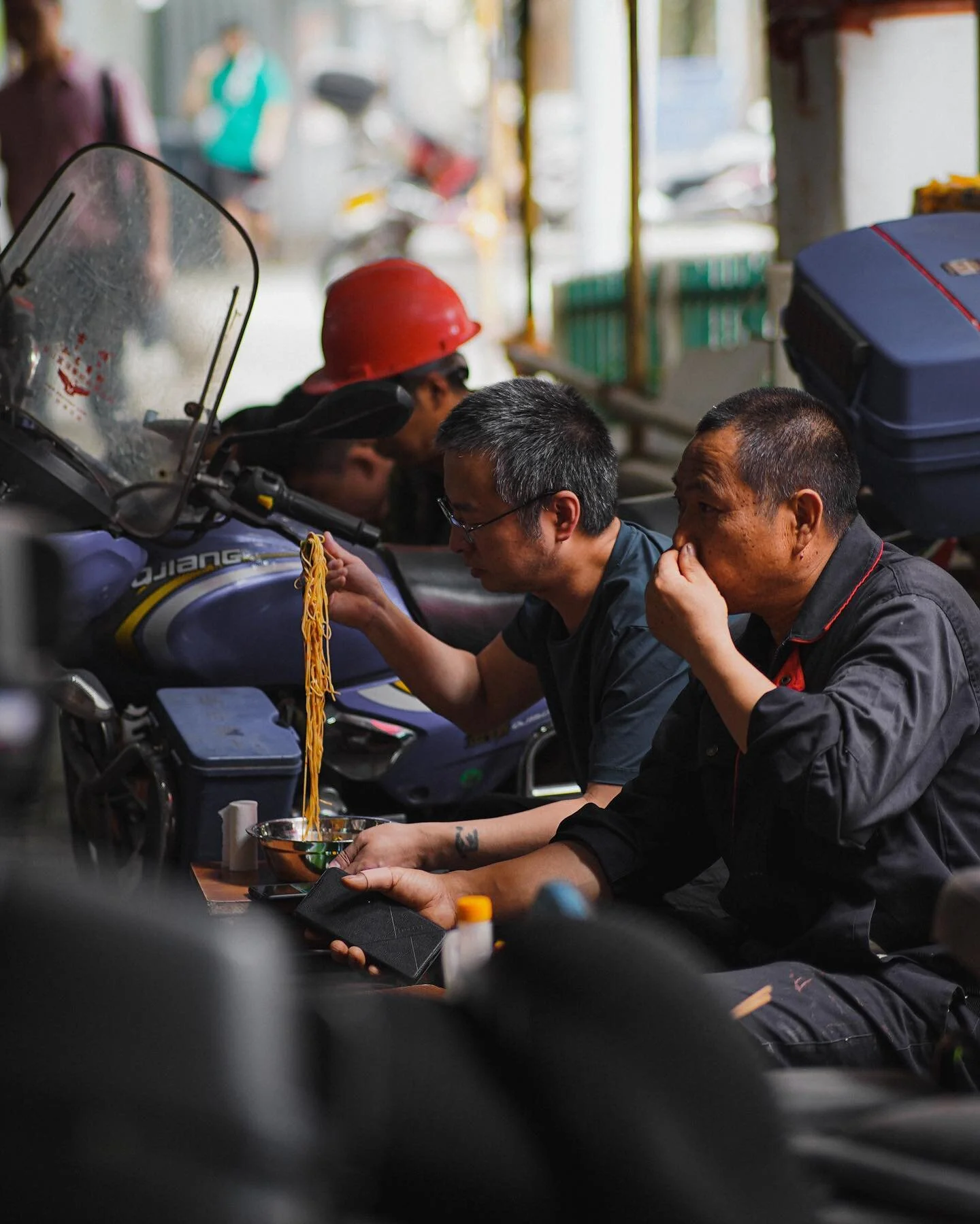 Beneath the scaffolding.