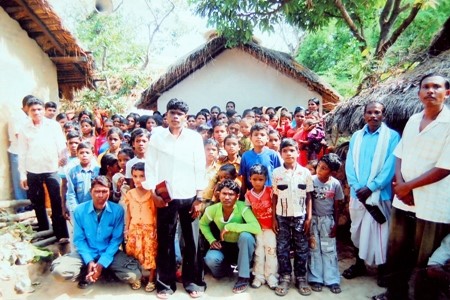 The church in Amda Village with evangelist Dhansai Bhotra, the young man in the white shirt in the middle