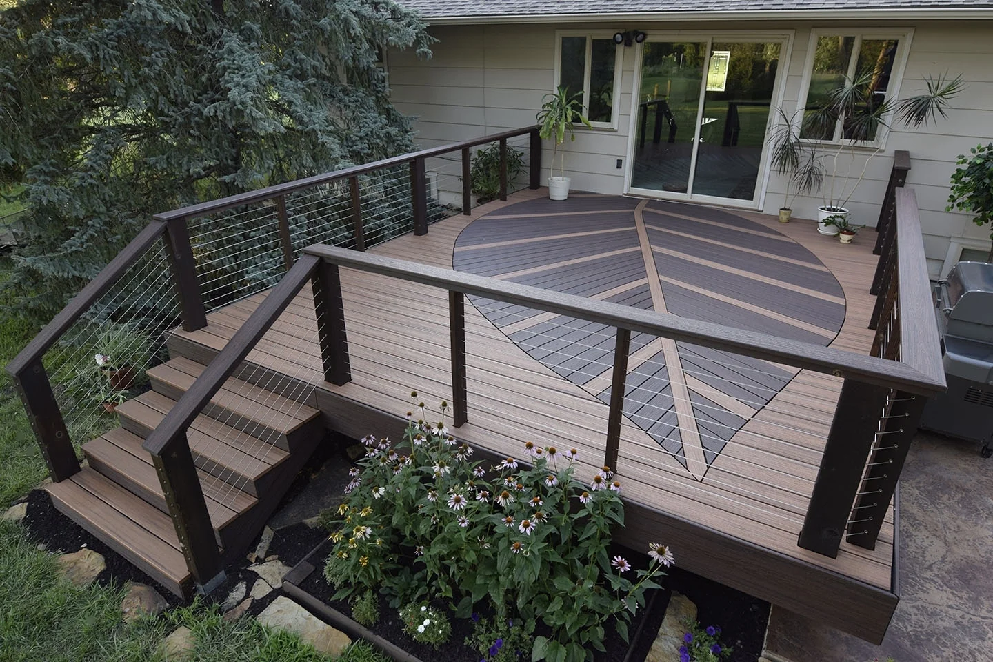  Cable railing allows a view of your scenery while also allowing the pattern to be visible from the the yard. 