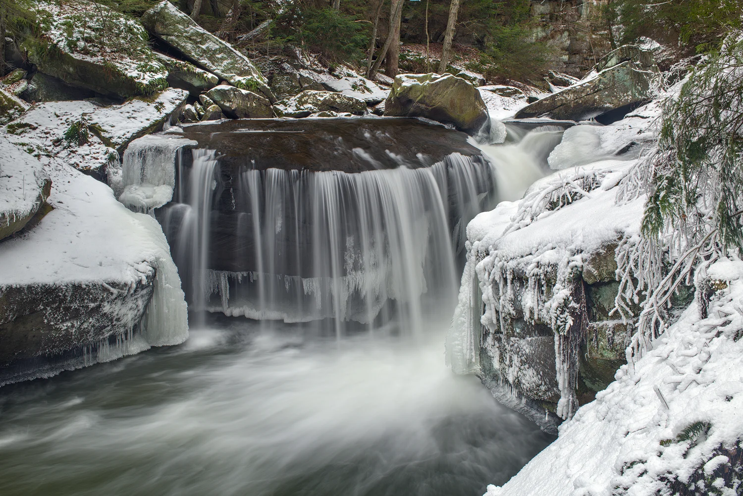 This view shows the large shelf that forms the Lower Falls. At over ten feet in height, the water at a high flow drops into a deep plunge pool.