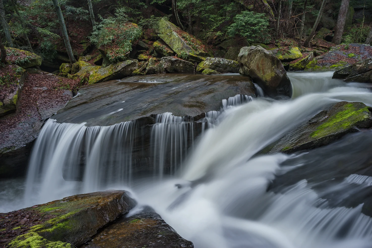From this angle a roaring and deep slot is framed by feathery fingers of water on the Lower Falls of Muddy Creek. Shot with a Sony a7II and a Zeiss Loxia 21mm, f2.8. Image exposed at ISO 50, at f11 for 3.0 seconds.