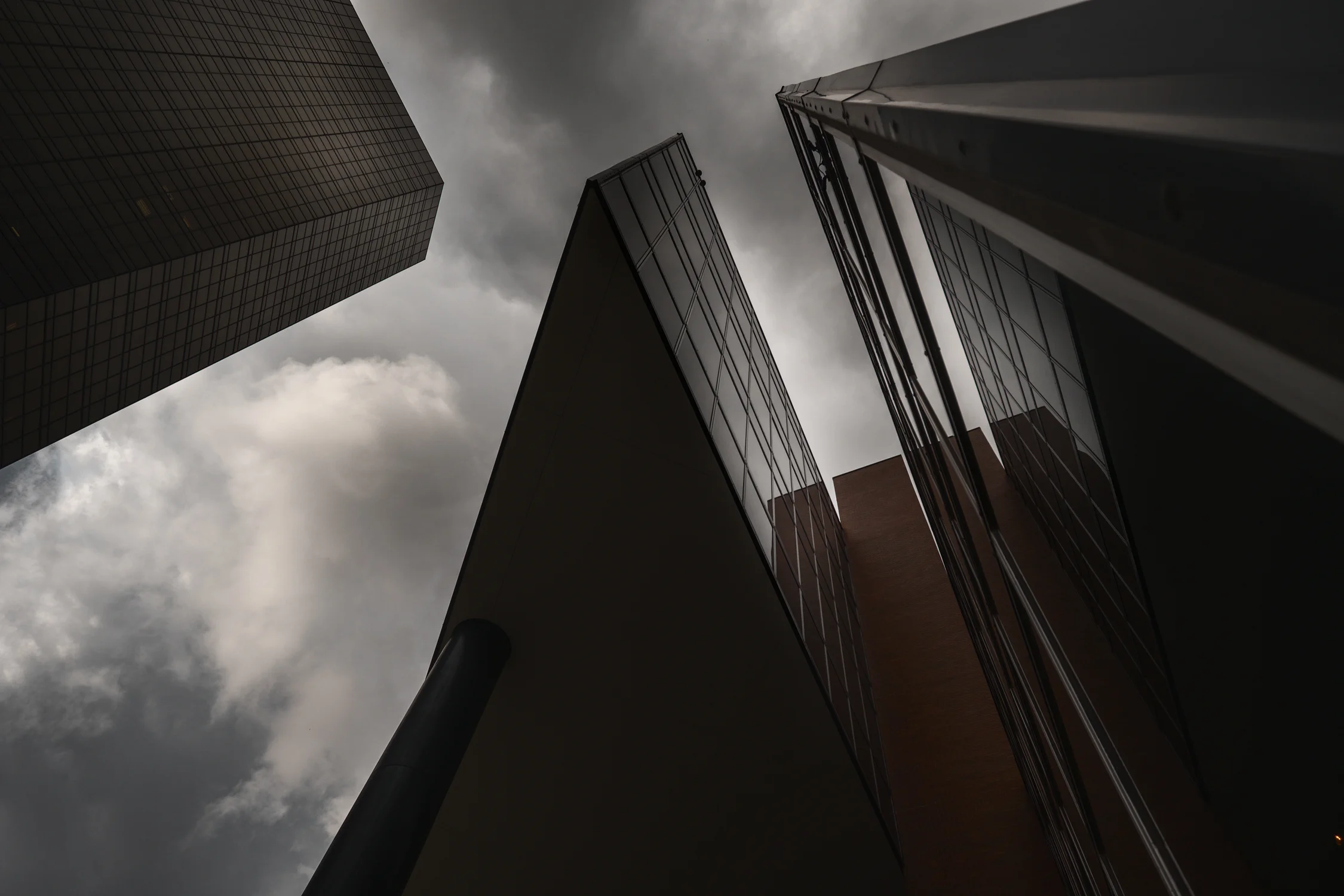 Clouds drift over a wedge of buildings. Fuji X-Pro 2 and a Fujinon 10-24mm f3.5.
