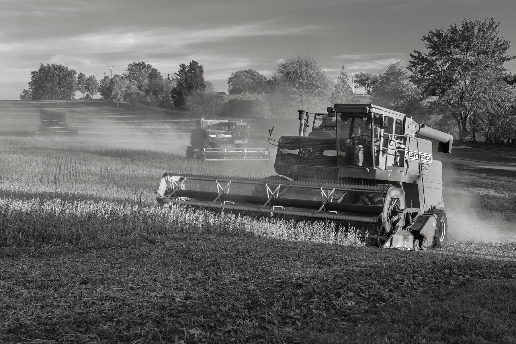 Three combines work the soybean fields at Shepherd's Hey Farm, MD. Fuji X-T2 and a Fujinon XF55-200mm at 55mm. Image exposed at ISO 200 at f5.6 for 1/60 of a second.