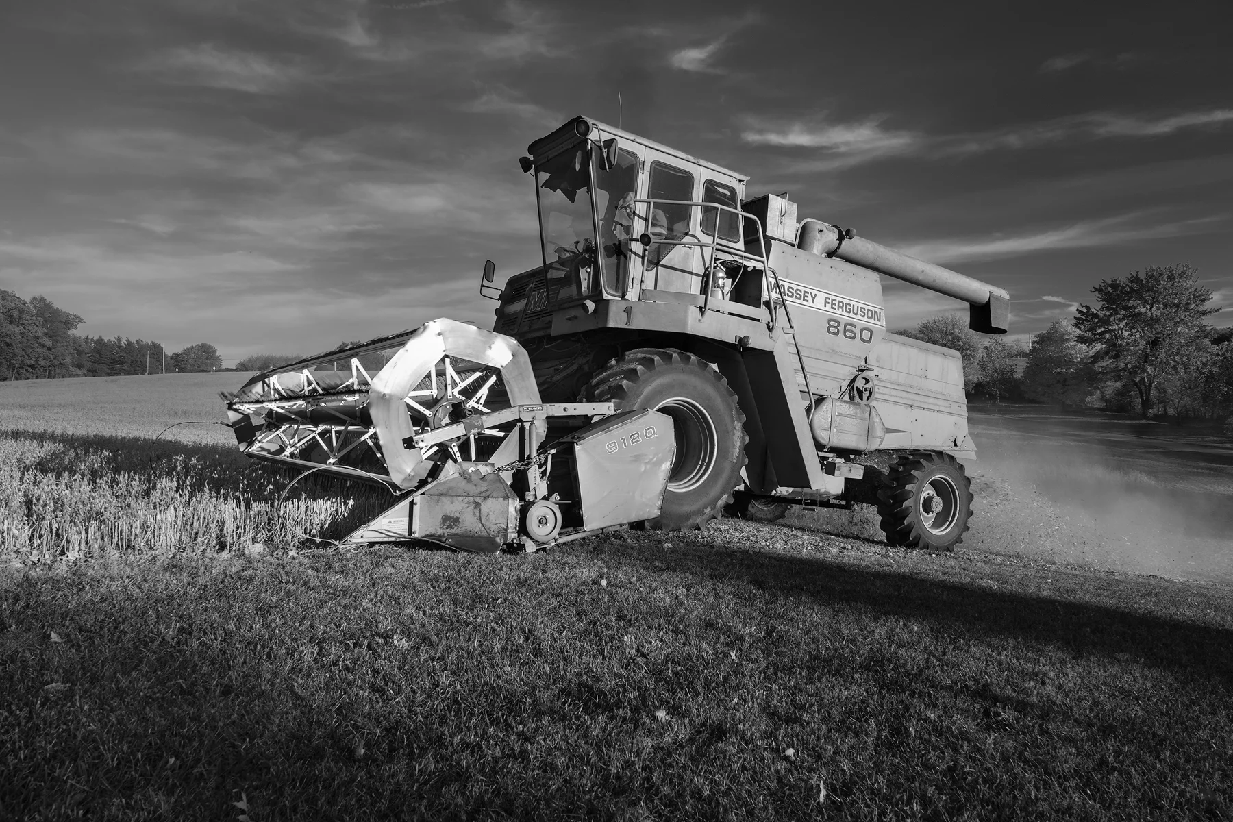A big combine cuts along a new row. Fuji X-Pro 2 and a Fujinon XF16-55mm at 16mm. Image exposed at ISO 400 at f5.6 for 1/60 of a second.