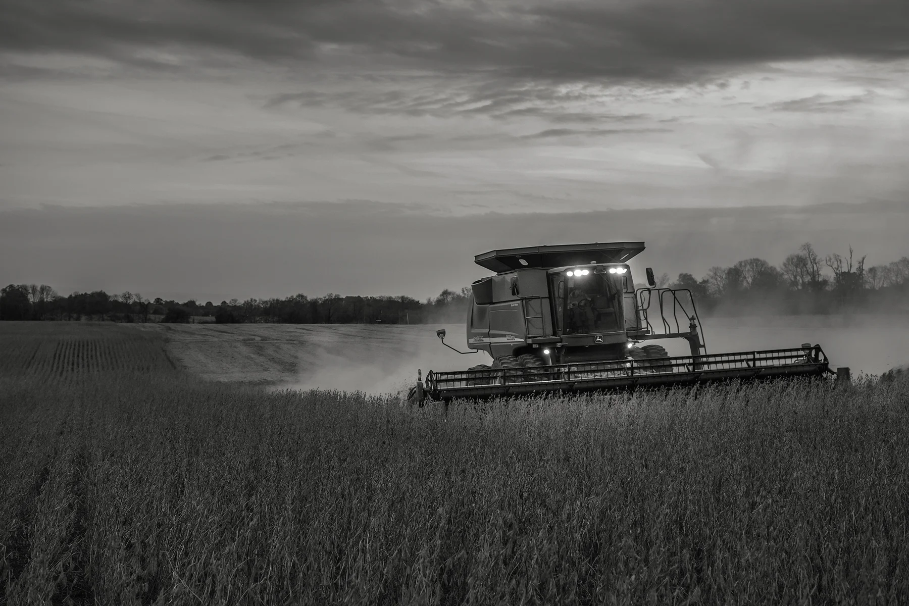Running lights from Steve's combine light the way as another row is harvested. Fuji X-T2 and a Fujinon XF16-55mm f2.8 WR at 35mm. Image exposed at ISO 800 at f4 for 1/60 of a second.
