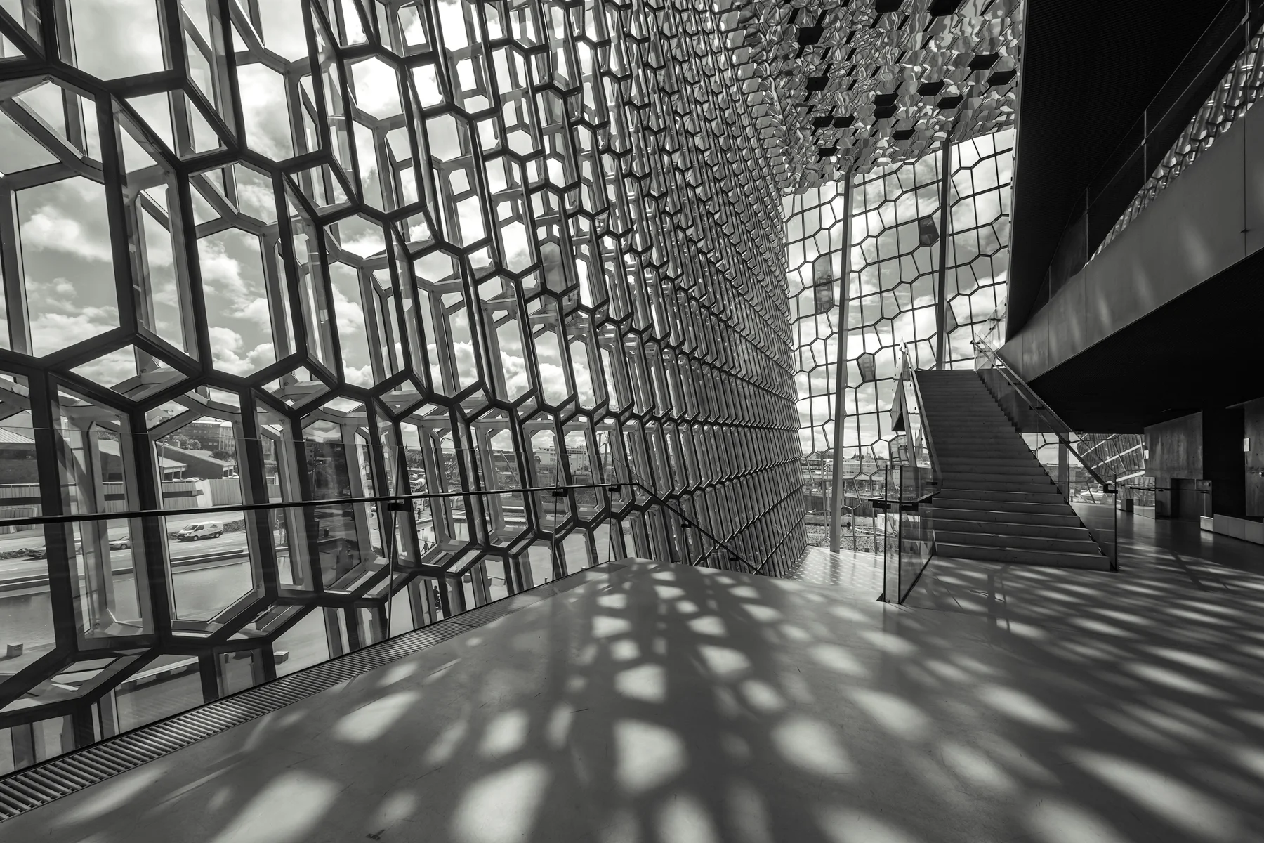 Reflected patterns stream along the floor along the south facade.