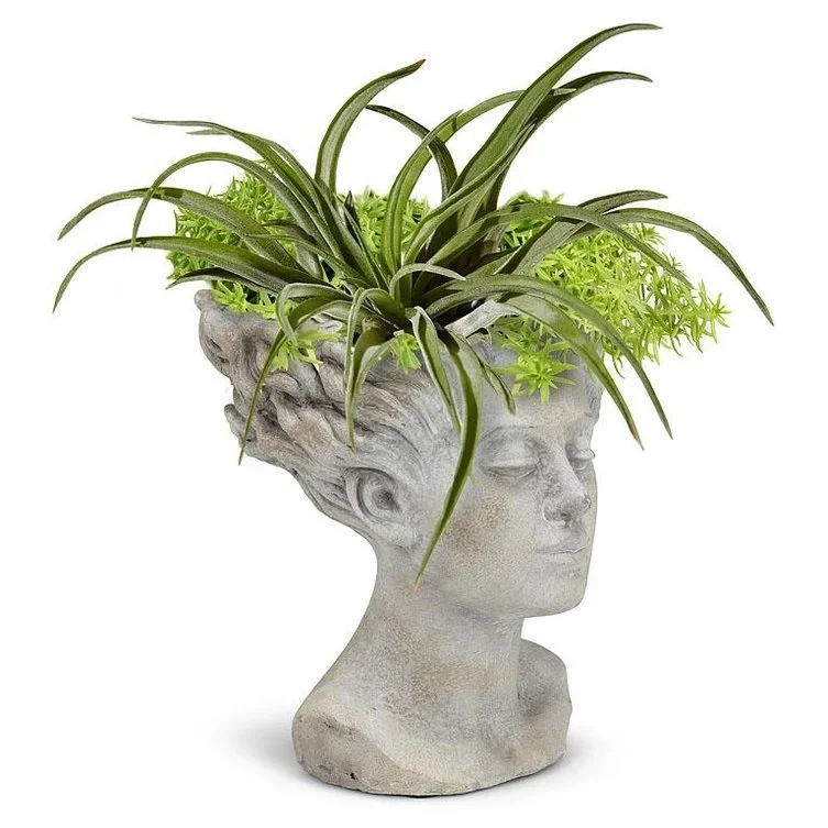 woman-with-blowing-hair-cement-planter-museum-outlets.webp