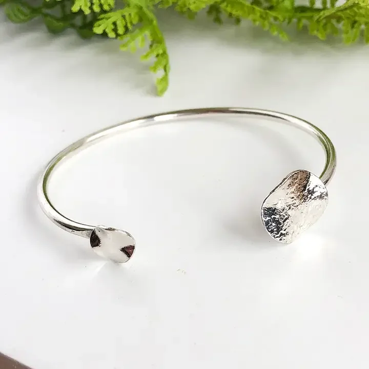 silver-solaris-hammered-handcrafted-cuff-bracelet-kantha-jewelry-museum-outlets.webp