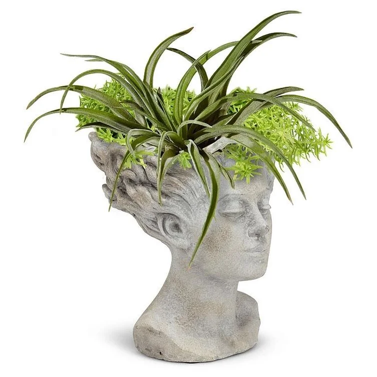 woman-with-blowing-hair-cement-planter-museum-outlets.jpg