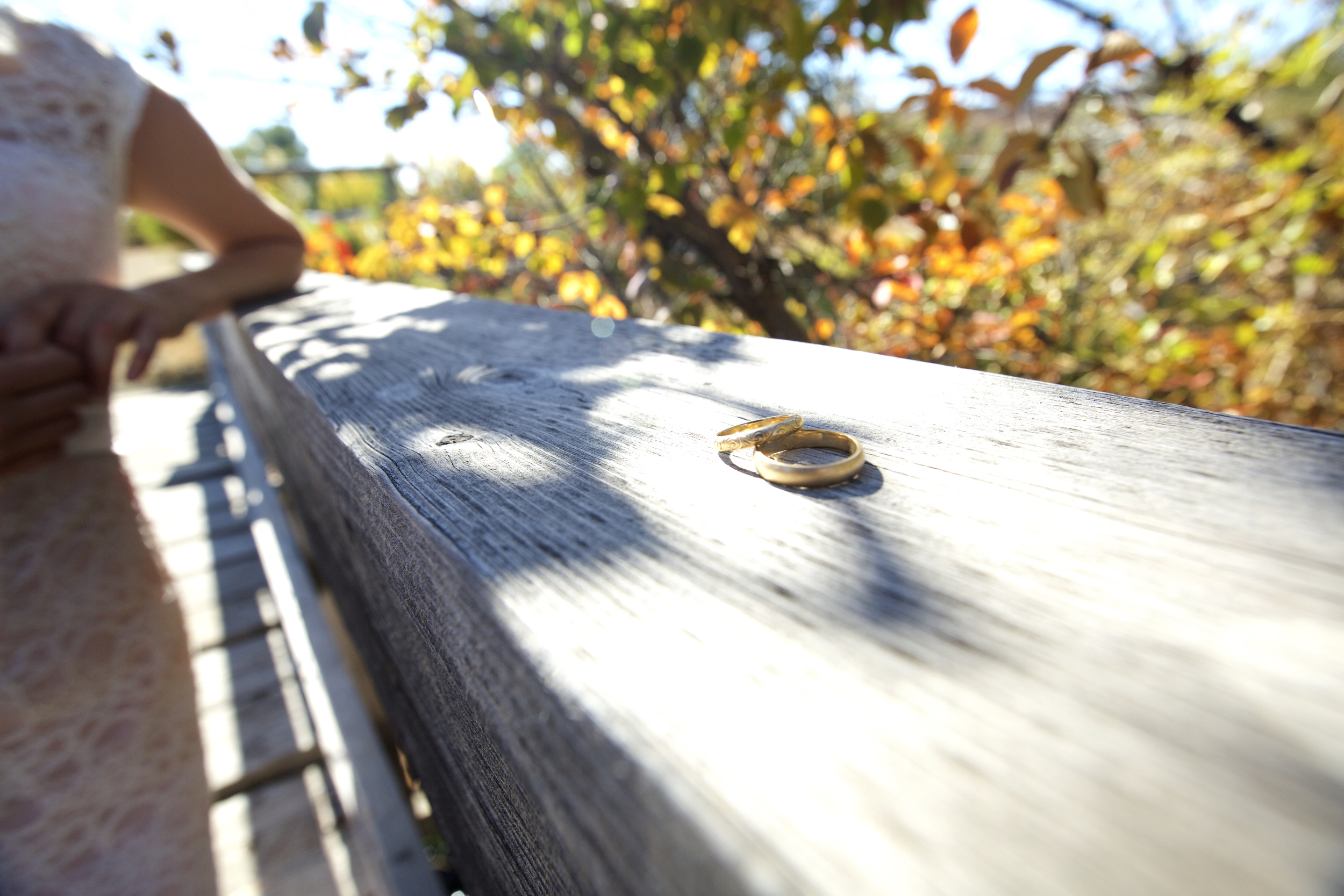 Rings by Keelin & Paige: 14k yellow 3mm half round with a polished finish and was hand engraved to match her mothers wedding band. 14k yellow 4mm half round band with a brushed finish Photo by Meg Valliant