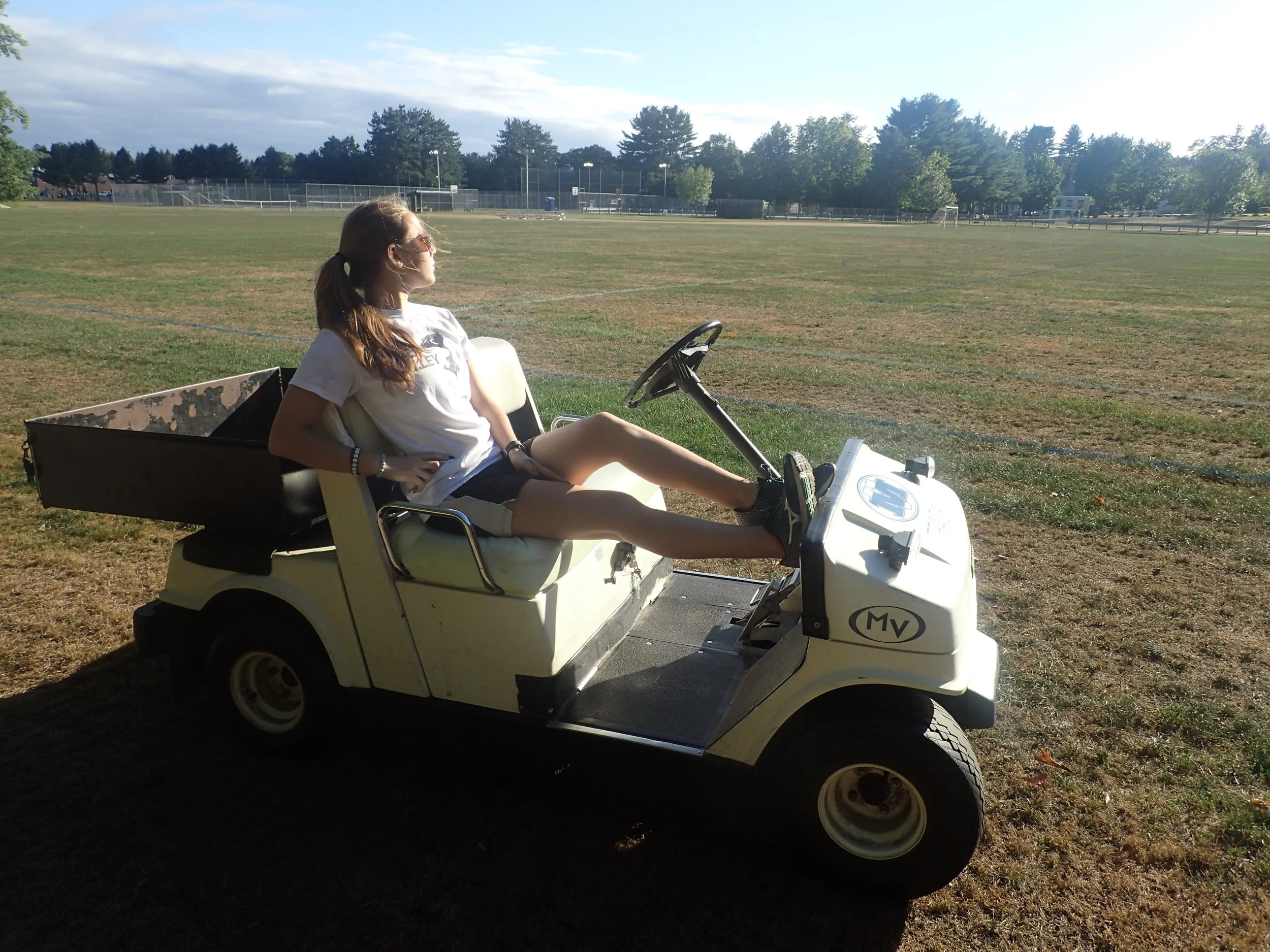 Our photographer and Head Cheerperson Miranda catching some rays.