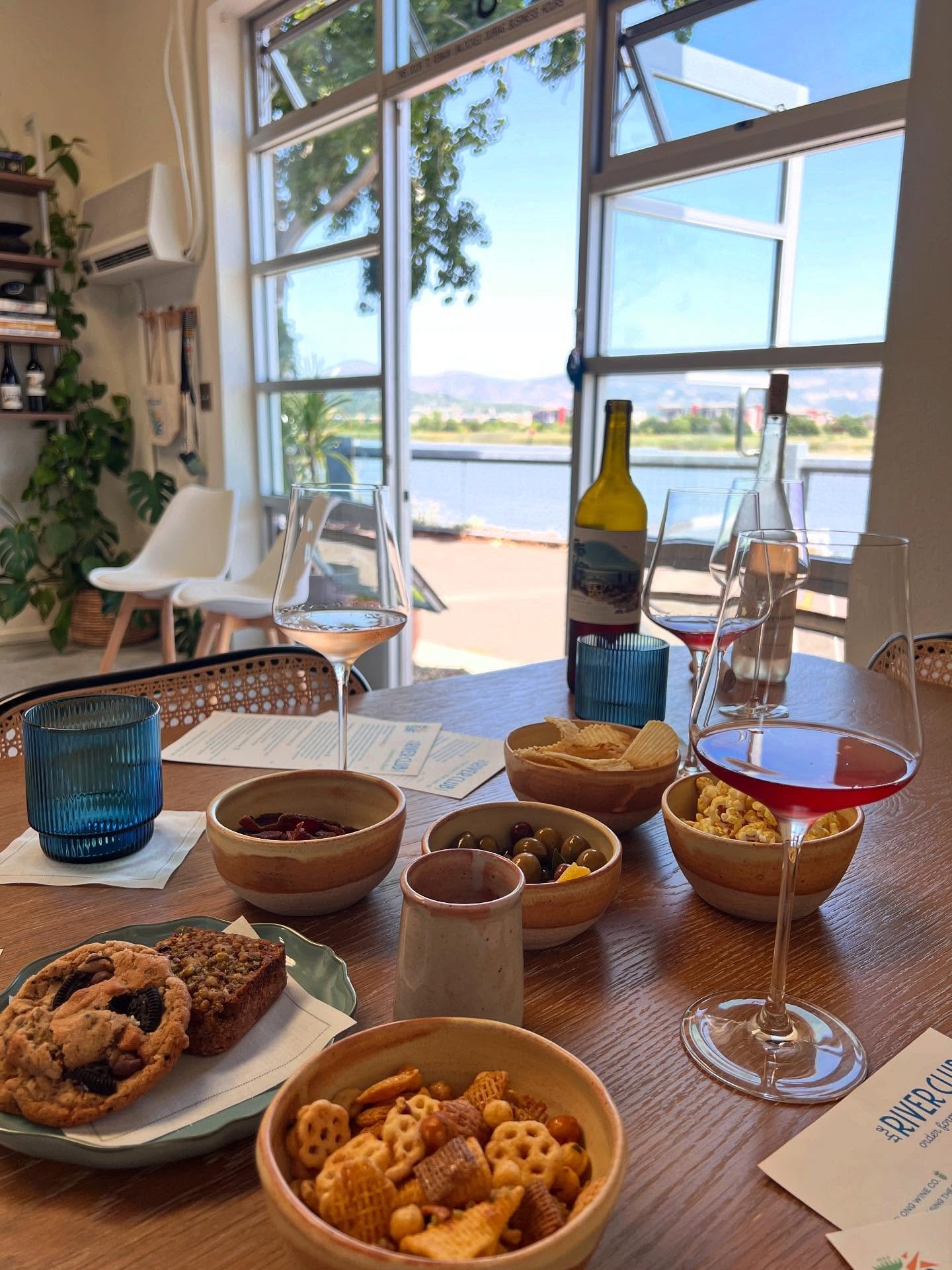 Did you hear? Our new snack menu has dropped at The River Club and it is giving big weekend energy. 

Stop by and add on to your tasting, or just pop in for a glass or bottle and order one of each! 

⚠️ WARNING ⚠️ you will probably need an additional