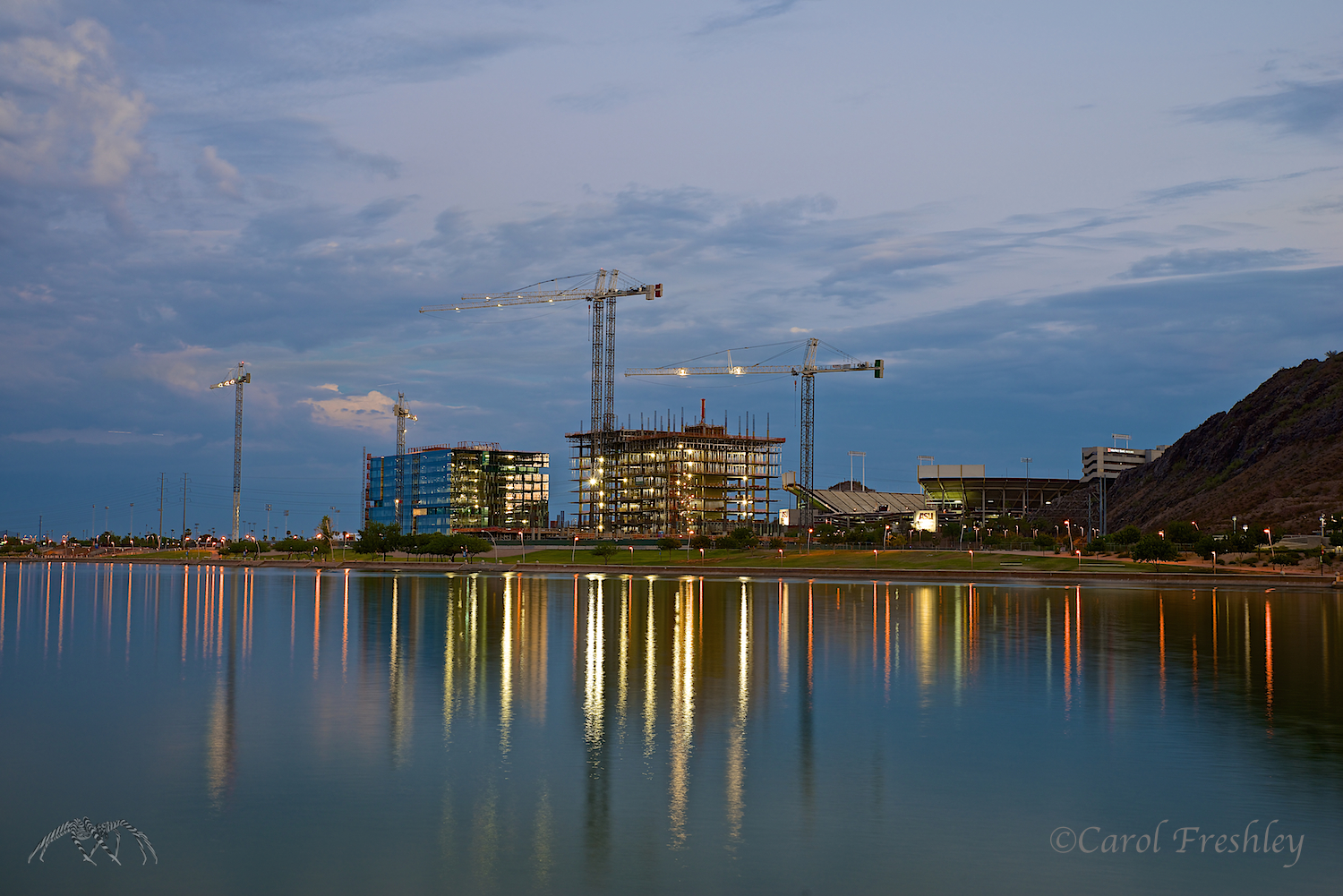 ISO 100, 46mm, f/8, 1 EV, 6 seconds at 7:33 PM. More lights are coming on. How can one get starbursts with an f/8?