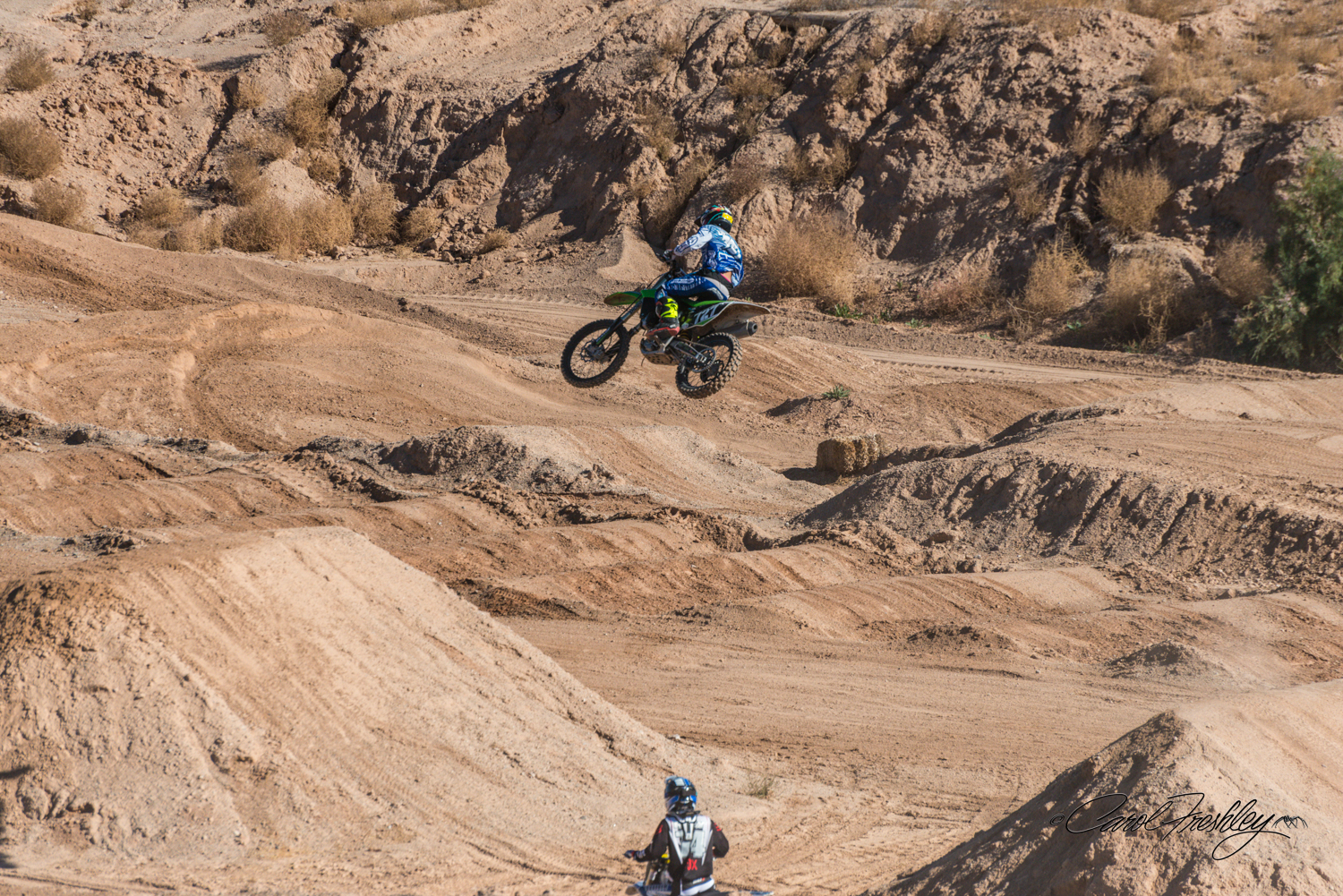 Defying gravity! He jumps from the hill on the right . . . landing?