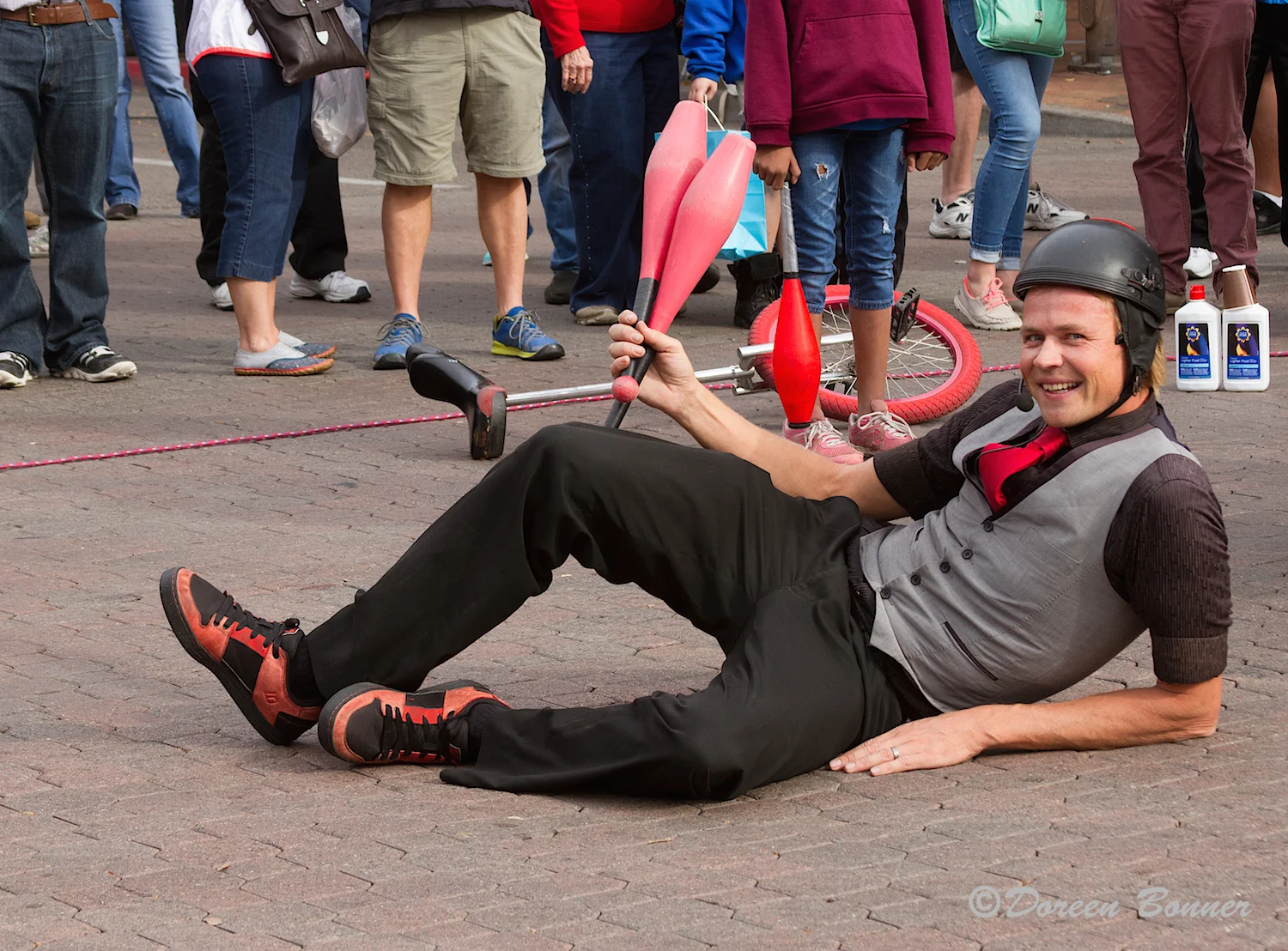 The unicyclist saw Doreen with her camera and asked her if he laid down would she take his picture. He did and she did. Then he remarked, "That'll be $20.00." Quite the comedienne!