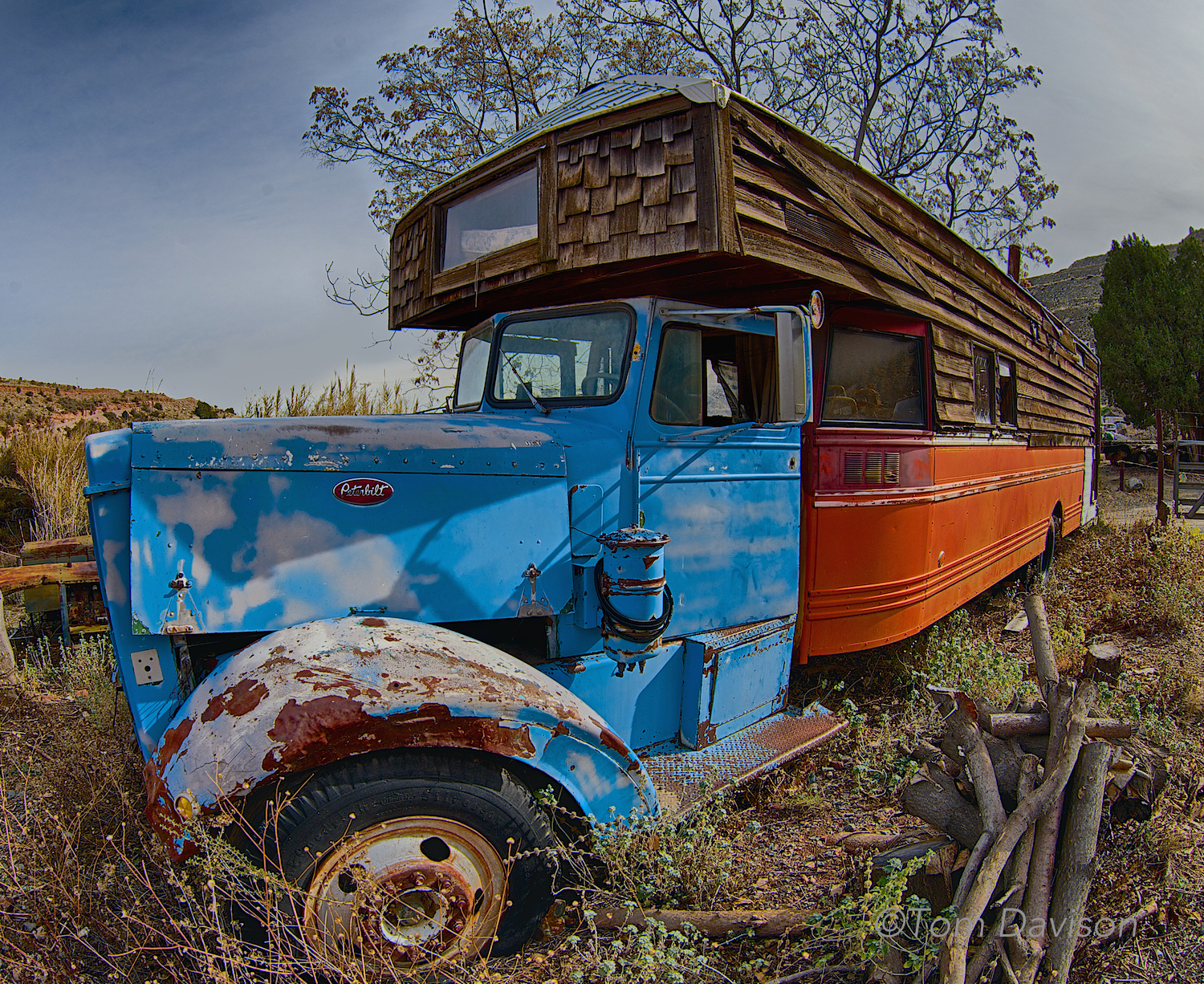 An old motor home. I would have been happy just walking around and capturing its funkie character. Not Tom. He goes for the GOLD.
