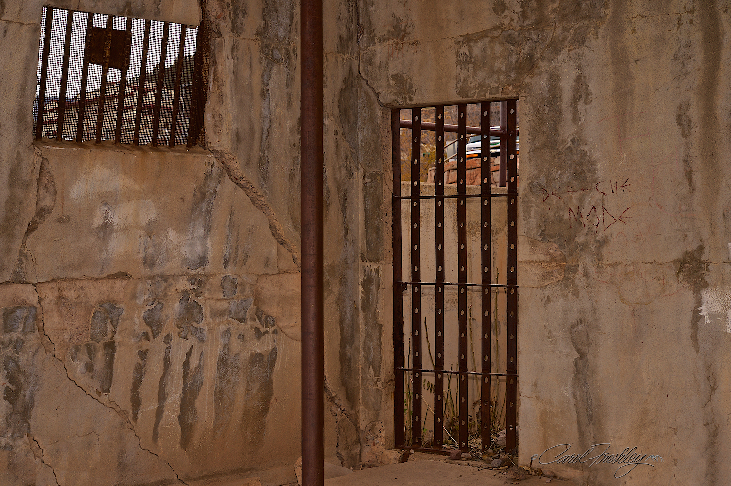 I have heard that this is the old jail and that it is sliding off the hill. Below is the real scoop.