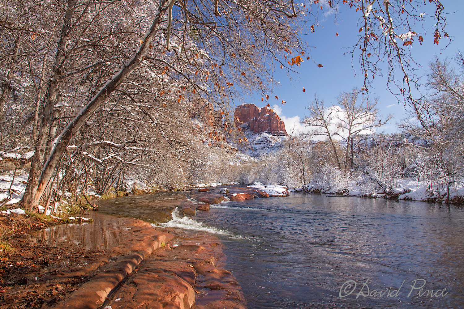 David's image, for me, captures a much better representation of the red rock, which then complements that lovely orange leaf above and the red in Cathedral Rock in the background. He cuts out the area across Oak Creek which really does not add anything to the image. It is a much tighter, more focused and interesting image than the one I took above. If you are asking what this would look like if the water was smooth and silky, you are asking a good question! EXIF: ISO 200, 16mm focal length, 1 EV, f/9 at 1/100 with Canon EOS 7D and EF-S15-85mm f/3.5-5.6 IS USM lens. Minimal post processing.