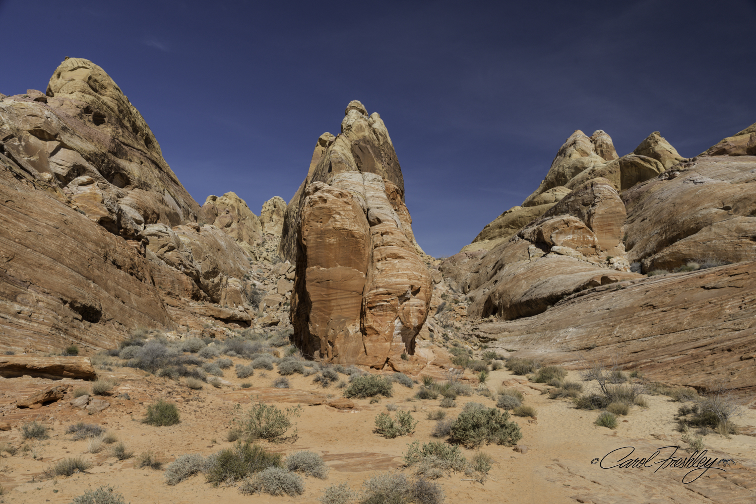 A different perspective. The climb out is the rocky incline on the right of the center rock formation!! Fortunately, Ann had come back down looking for me and was there to guide me safely up to the top. This is an area that has been featured in movies, including Star Wars.