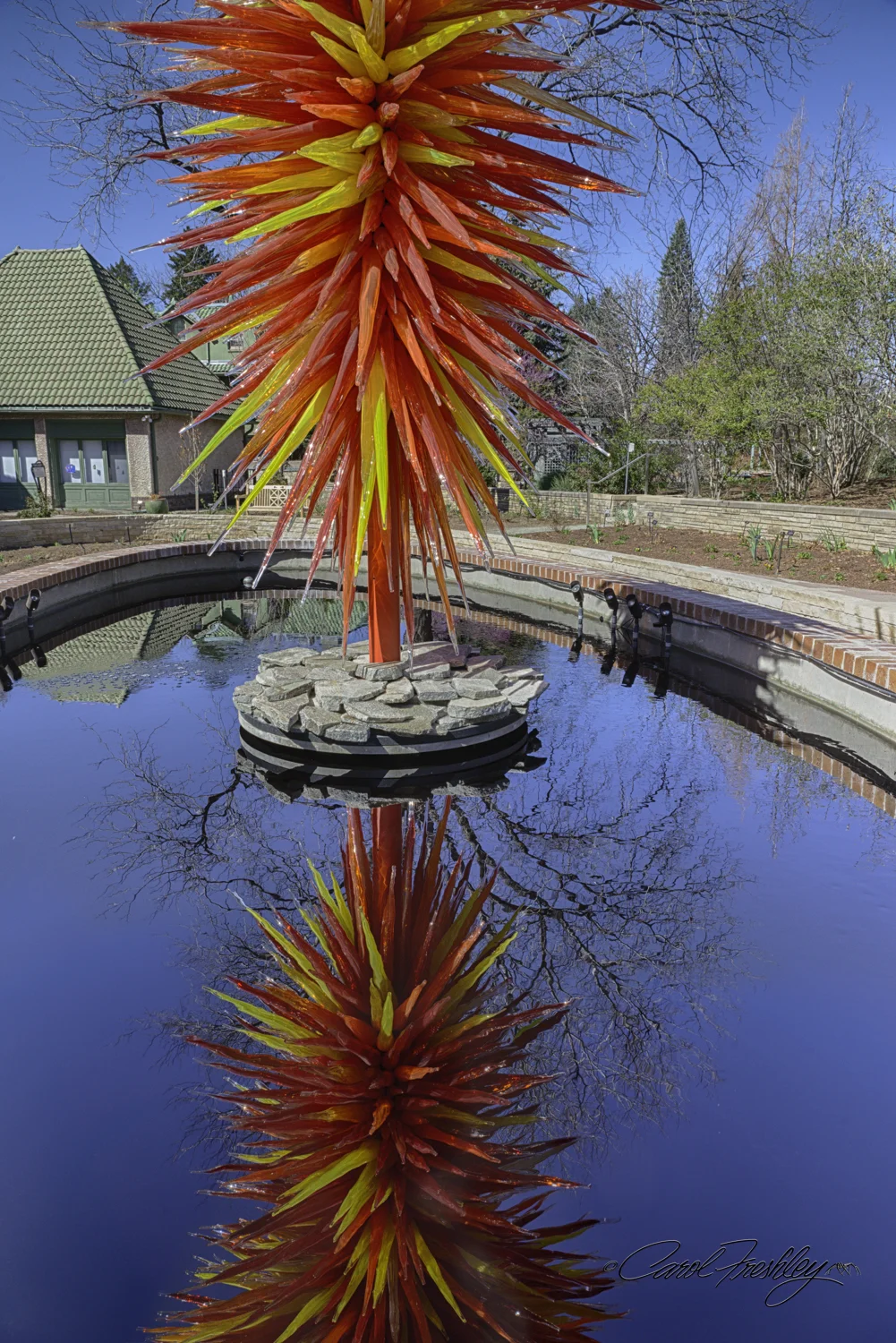 This was one of those "I want this image" situations. Problem? Yes! The upper part was blown out if I was to get any detail in the reflection. Plus, I wanted more of both the upper and lower parts of what I could so clearly see with my eyes. Even my 20mm prime could not get me the whole thing as close as I had to move in order to avoid a wall. Sigh! I ended up using my graduated neutral density filter on the widest lens in my bag at hand. It took a while!!