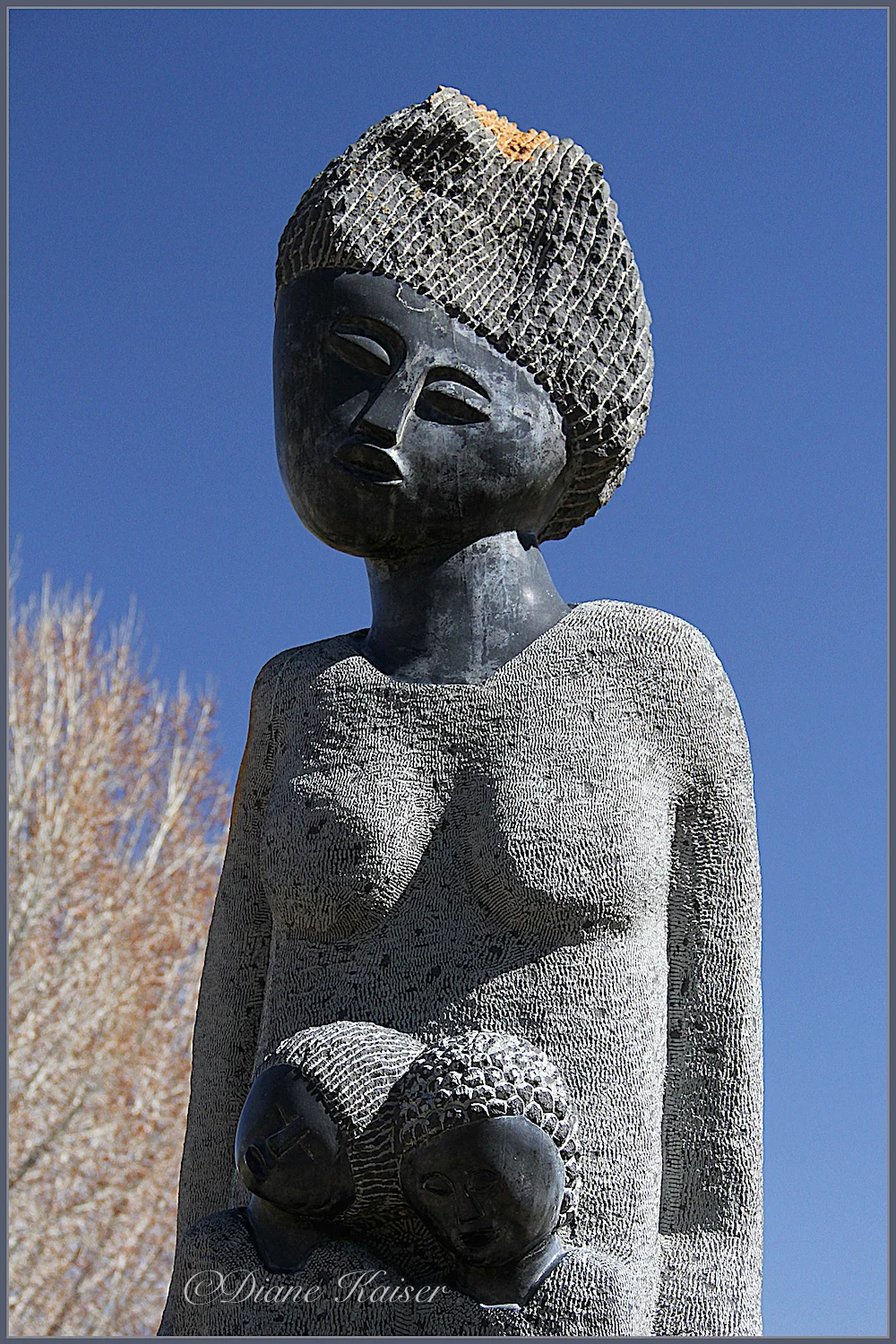 This was one of the few statues in the Garden (that I saw). I took a photo of the whole thing, but it got lost in the background. Diane had a different take. Then, as you will see below, she took a 'head shot', which I like but then she turned it into something entirely her own!! On the second photo below she is using the extrude filter in Photoshop. I include both so you can see what she started with and how her final image is much more interesting.