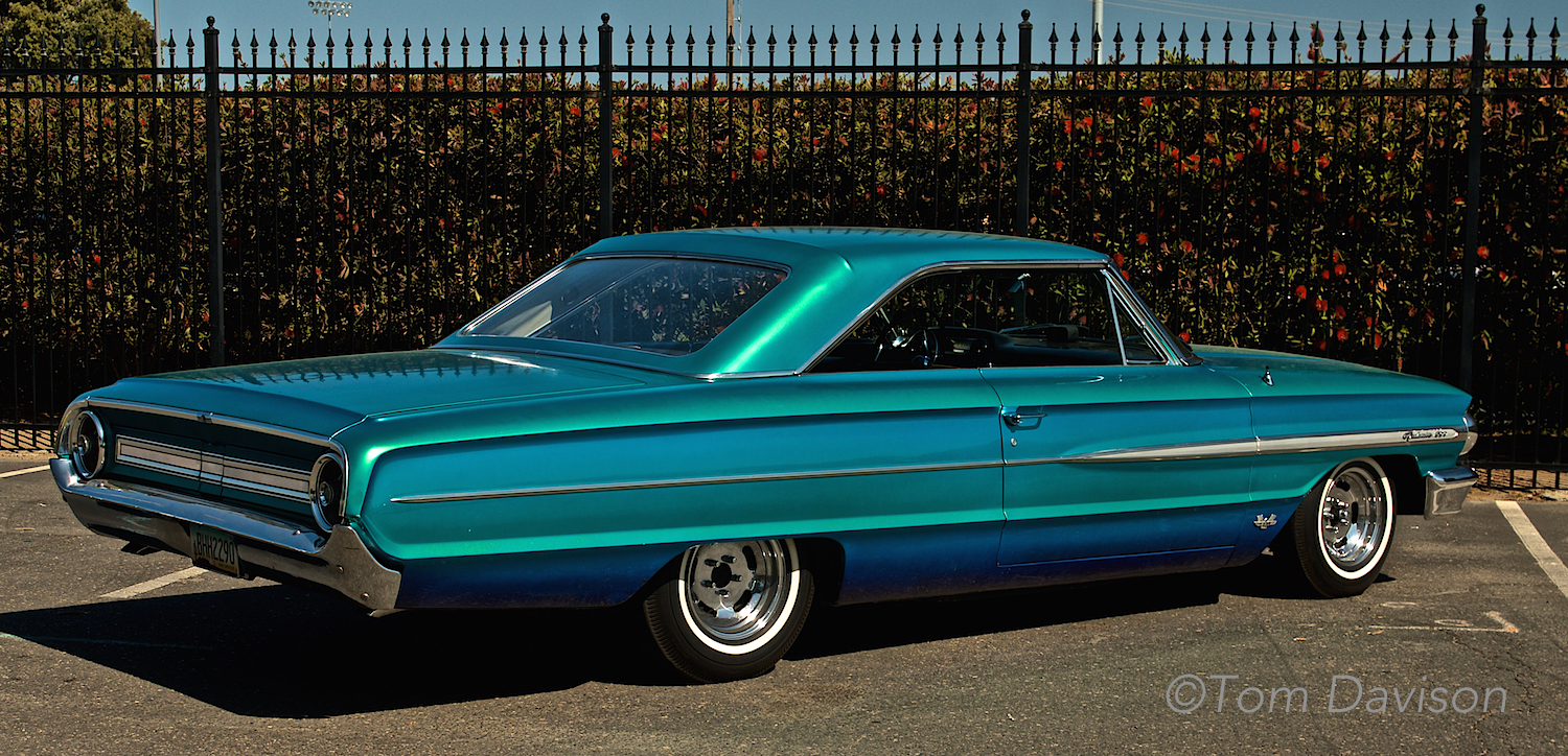 Tom's ride to the show. This is Jerry's 1964 Galaxie. It has the paint job that Tom applied to it in 1964. Jerry bought it for himself for his 20th birthday and asked Tom to paint it with three color blend of transparent blue, green and purple. It won best paint award at the World of Wheels Show in Kansas City in 1966. It had been in storage since 1972 and Jerry just recently got it out to restore it. Paint job has held up well!!!