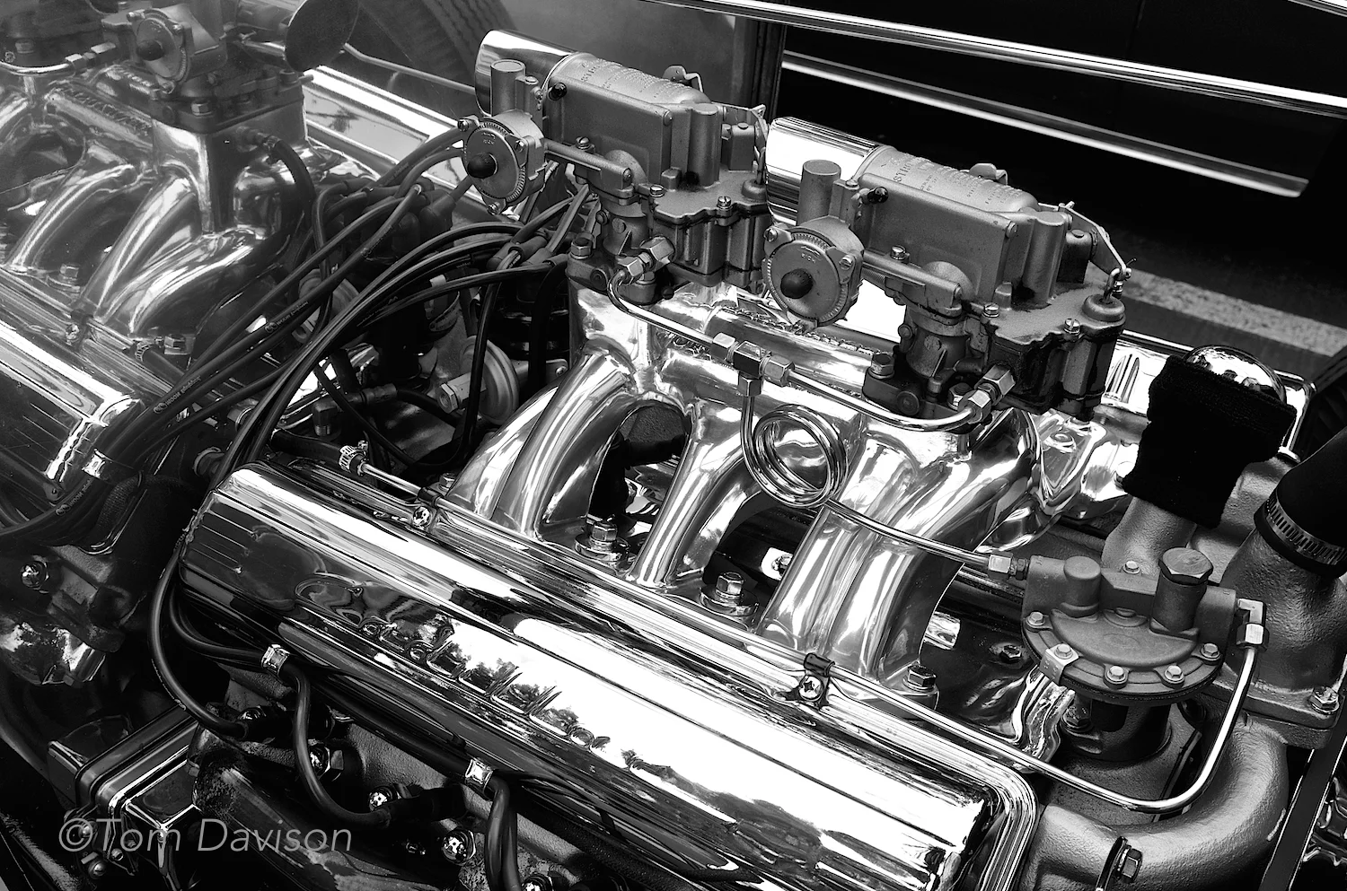 Hot rodded Cadillac motor powering in an early model Ford hot rod.
