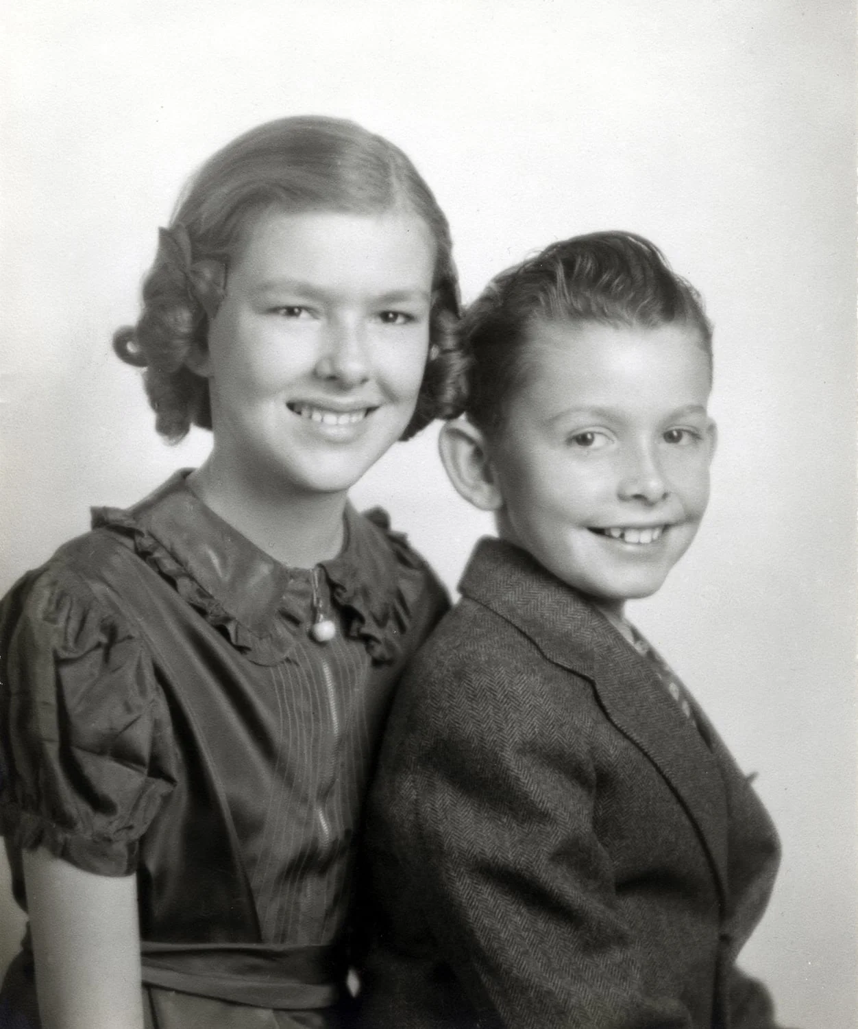 Shown here with her brother Joe. She was particularly fond of her younger brother, and shared his love of cars and racing. I believe this photo was taken when she was about 11. Joe died in his early 30s while our family was living in Buga, Colombia. Mom could not make it back for his funeral and I remember her crying for several days, feeling, I am sure, so very far away from the brother she had loved.