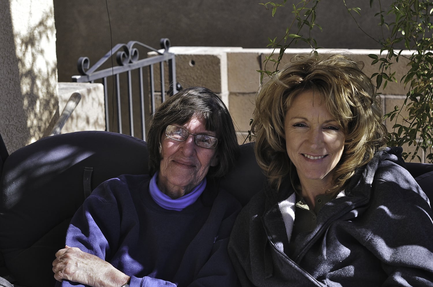 Mom sharing her swing with Koger, Larry's wife.