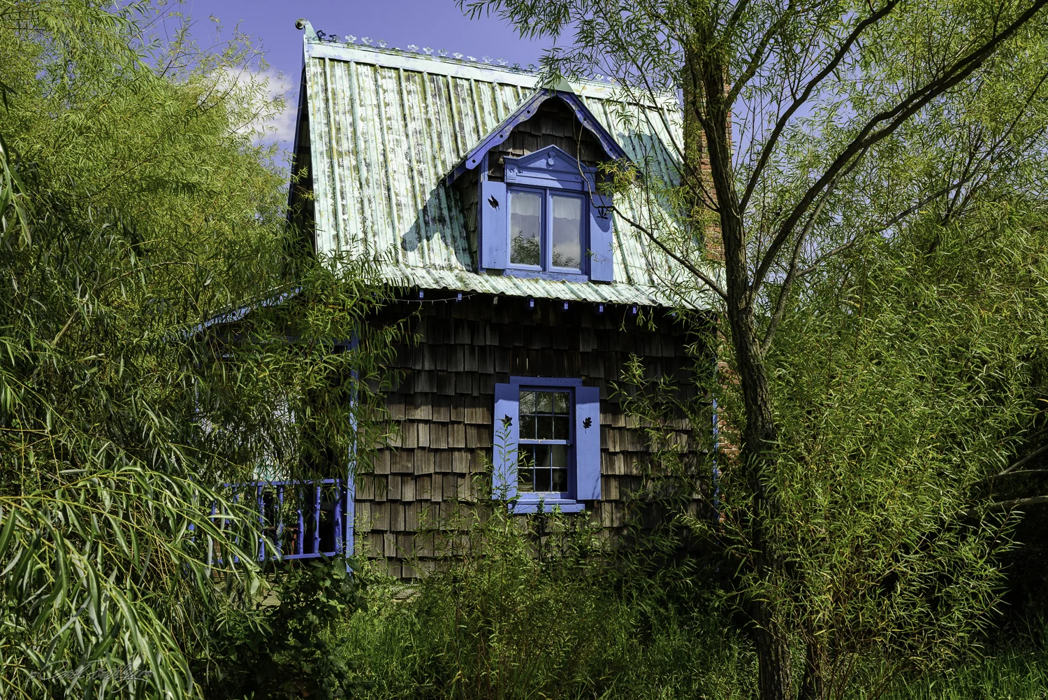 Cute little house that was right next to a small stream.