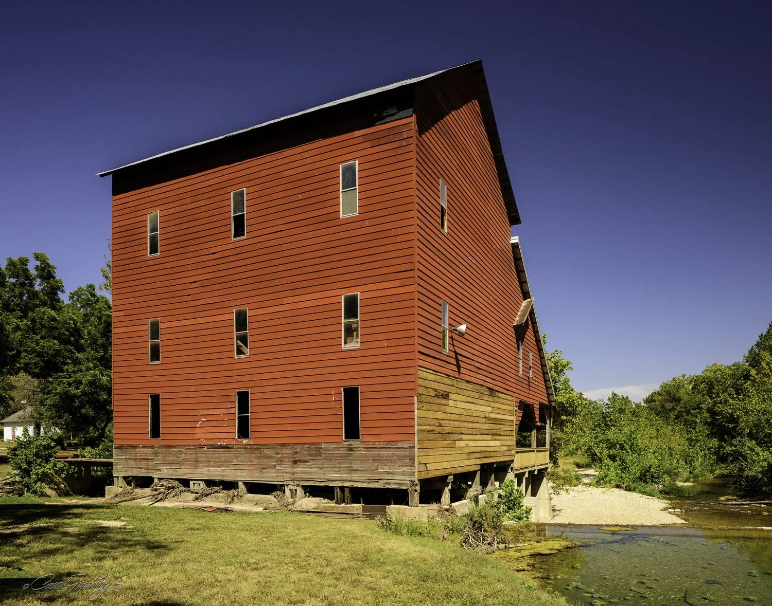 This might be considered the back side of the mill. When the flood occurred it took out the bar and dance floor. You can see the damaged side on the first floor. It also damaged the fish hatchery further downstream. While recovery is taking place, the bar is still not open for business.