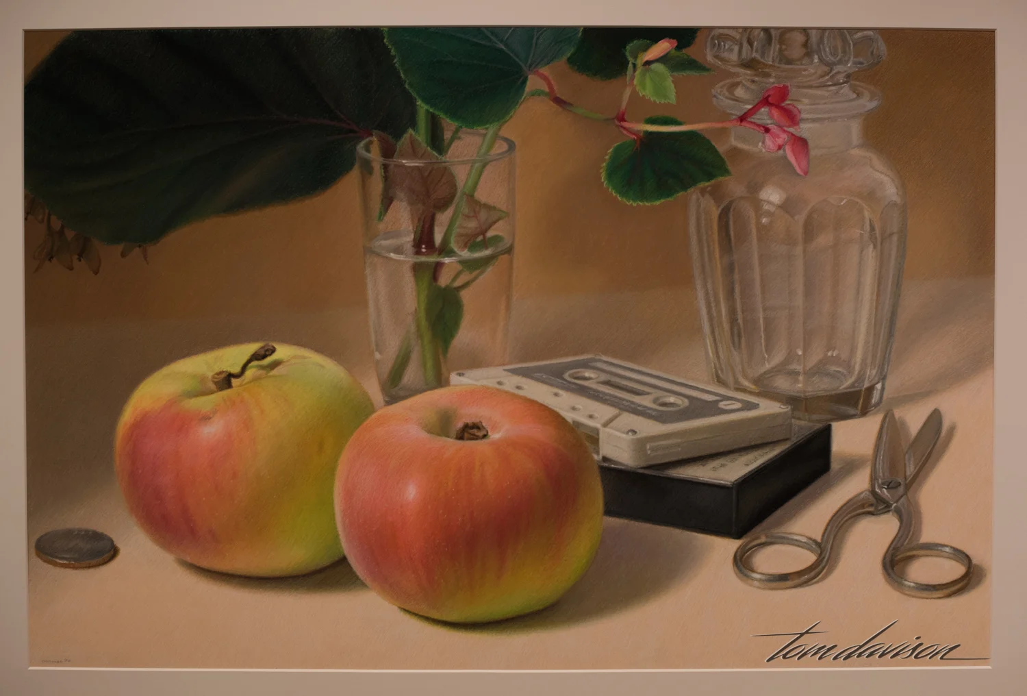 Mary Ann Currier painted this oil pastel on board entitled Carolina Apples. She is known for using commonplace subjects in her contemporary still lifes. In this painting she emphasizes the fleeting nature of existence by picturing music, food and other transient and sensual experiences. The artist was born in 1927. The painting was done in 1985.