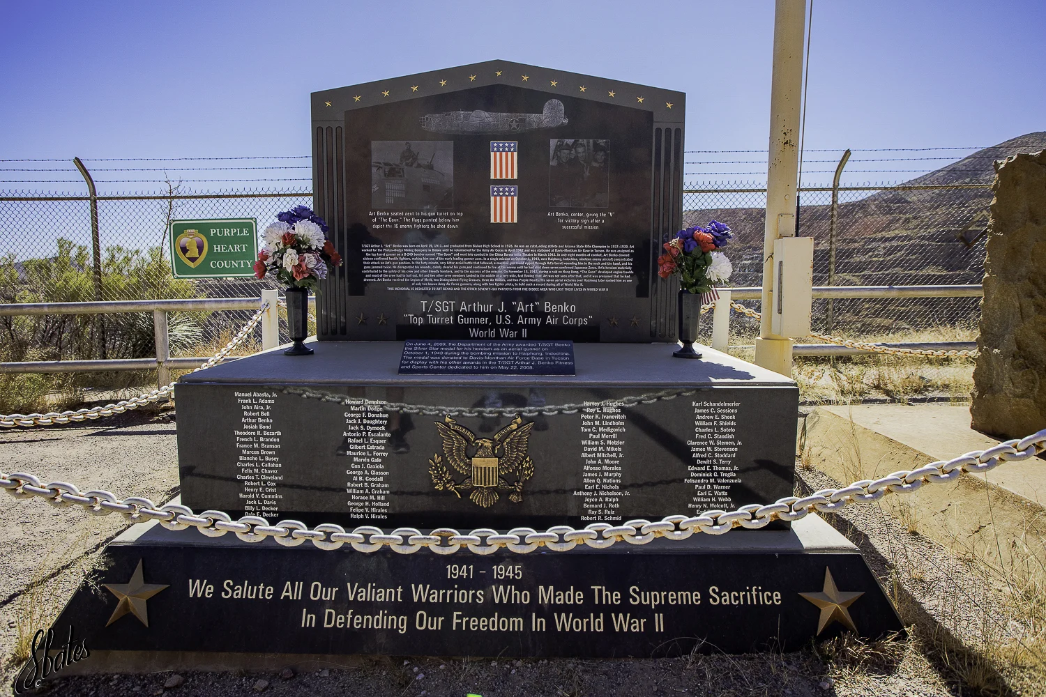 I suspect the fence in the background is to keep one from falling into the mine pit. But, the chain around the memorial and the fence caused me to pause . . .