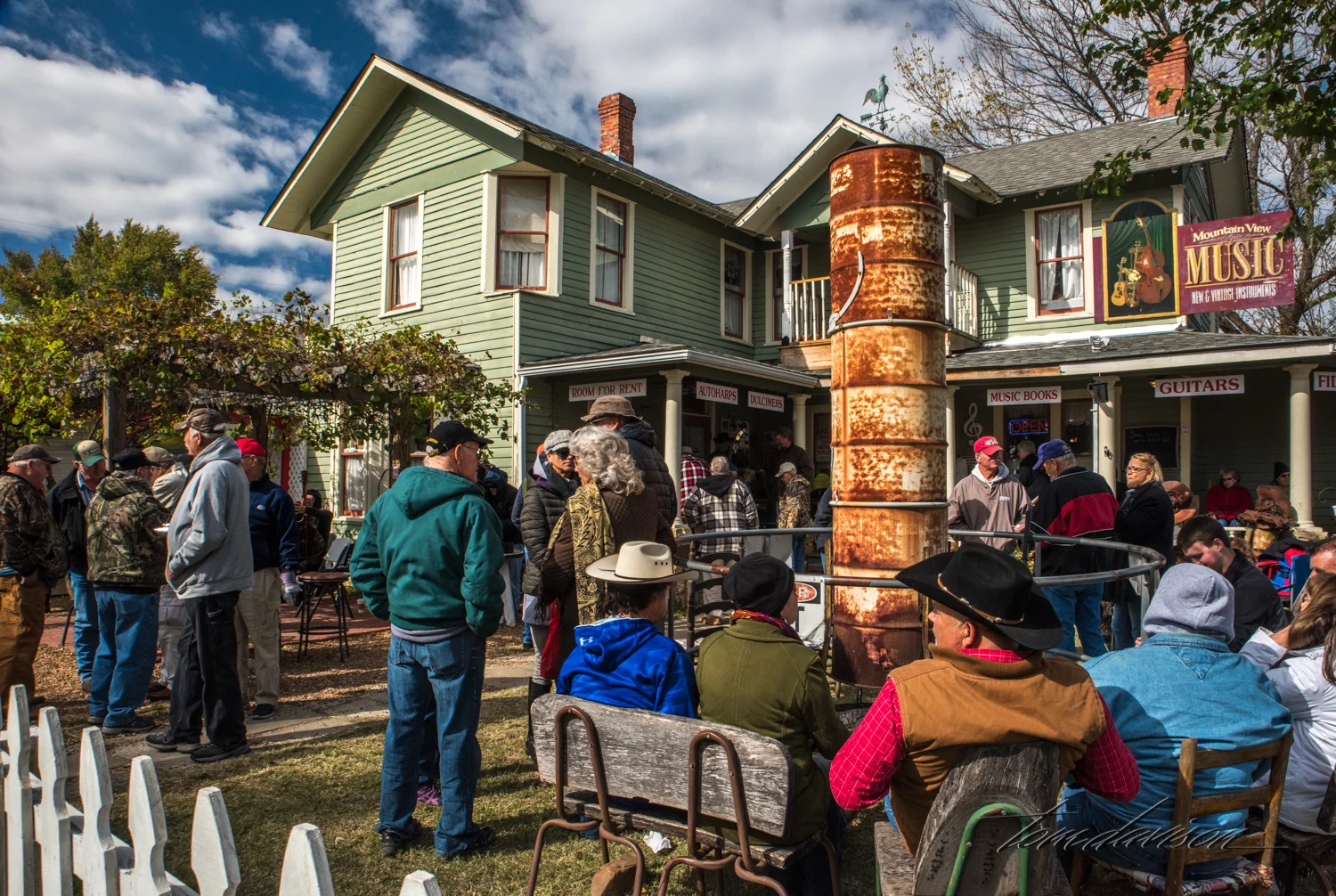 That rusted chimney had a fire built under it and it was a very welcome spot to warm one's hands. At different times there were as many as three separate groups playing in the area.