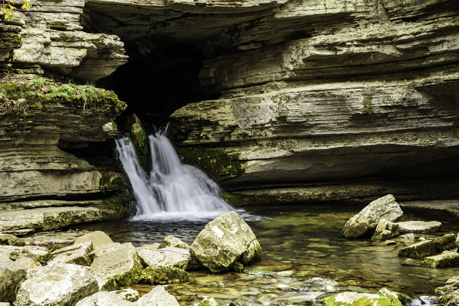 Blanchard Springs. The water just pours out of the side of the mountain. The water is very clear and cool. But, the signs tell folks that the spring comes from an area inhabited by bats and thus, while pretty the water is unsafe to drink or swim in.
