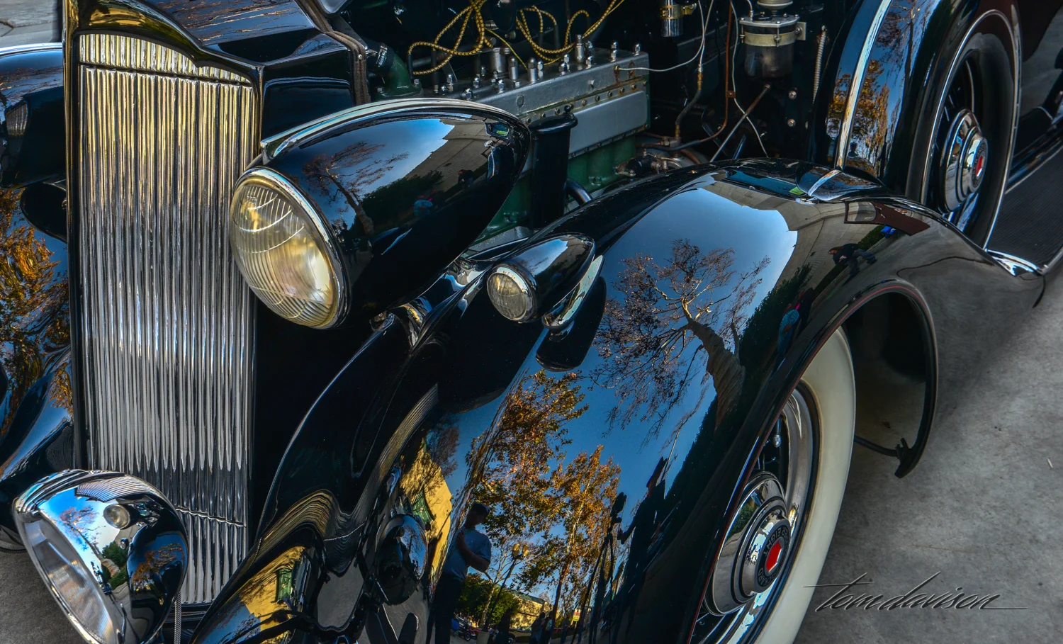 Reflections on 1937 Packard fender.