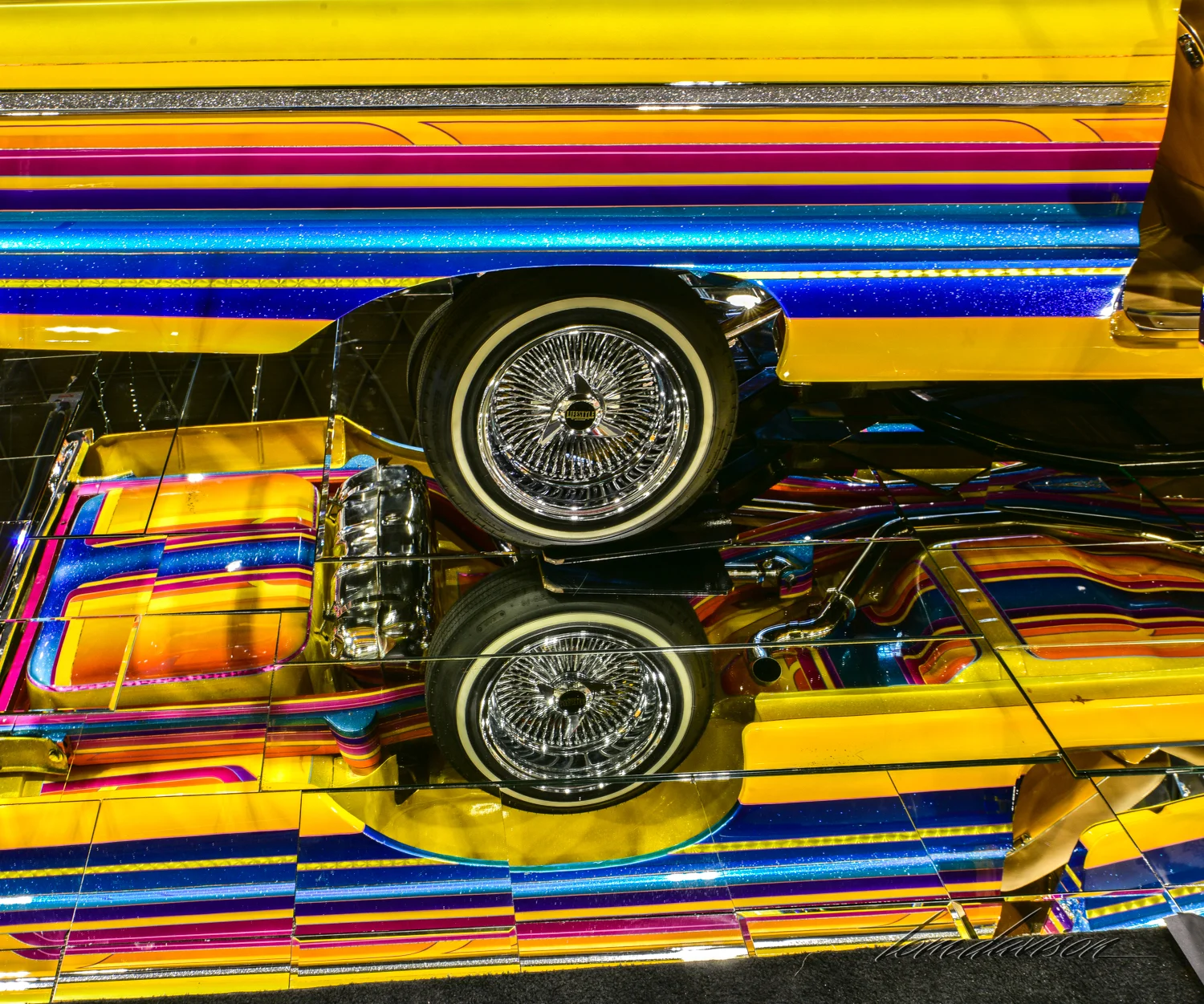 Lavishly painted low rider top and bottom.