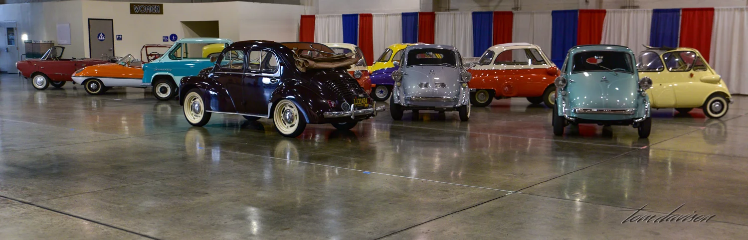 Display of mostly tiny European cars from the past.