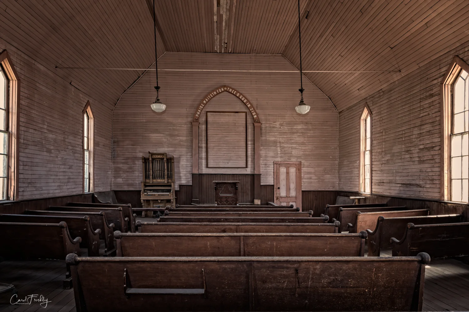One cannot enter the church. But, you can get a decent photograph by holding your camera such that it pokes it lens through the wired 'fence'.