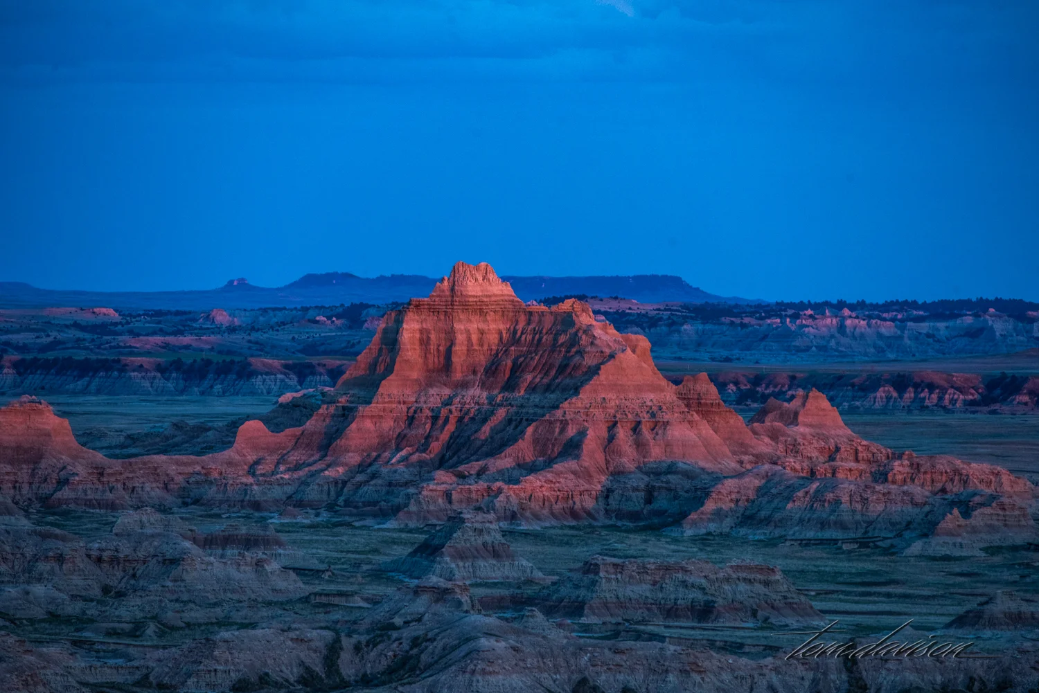 Taken later in the same place with some late light reflecting on just this one hill.