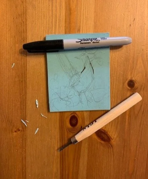 2a. Sketching an idea, I think trace the final drawing with a Sharpie.  2b. Next, I use a gouge tool, this is Niji brand, to carve out the areas I do not want to print. Unfortunately, I got so into carving, I forgot to take a picture of this part!